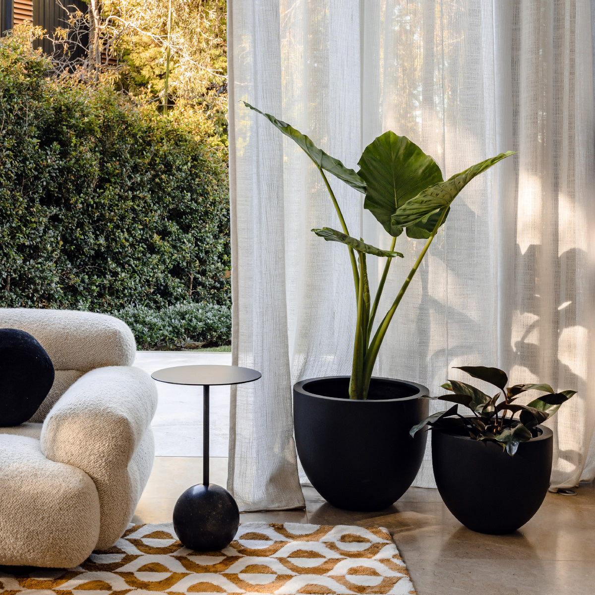 The Balcony Garden Tub planter in white, egg-shaped with smooth surface.