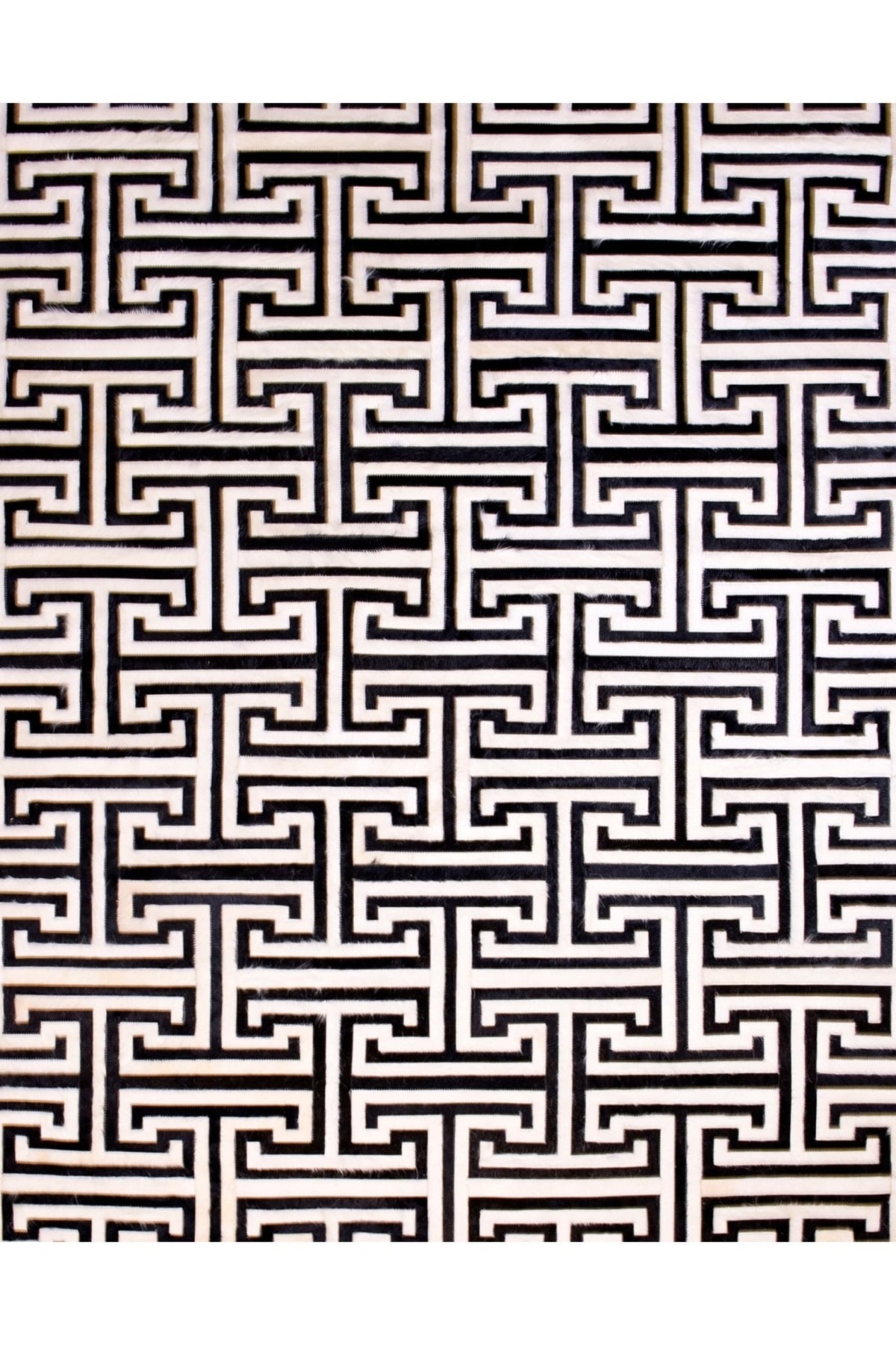 T Model – Maze-Inspired Cowhide Patch Rug by Homelosophy