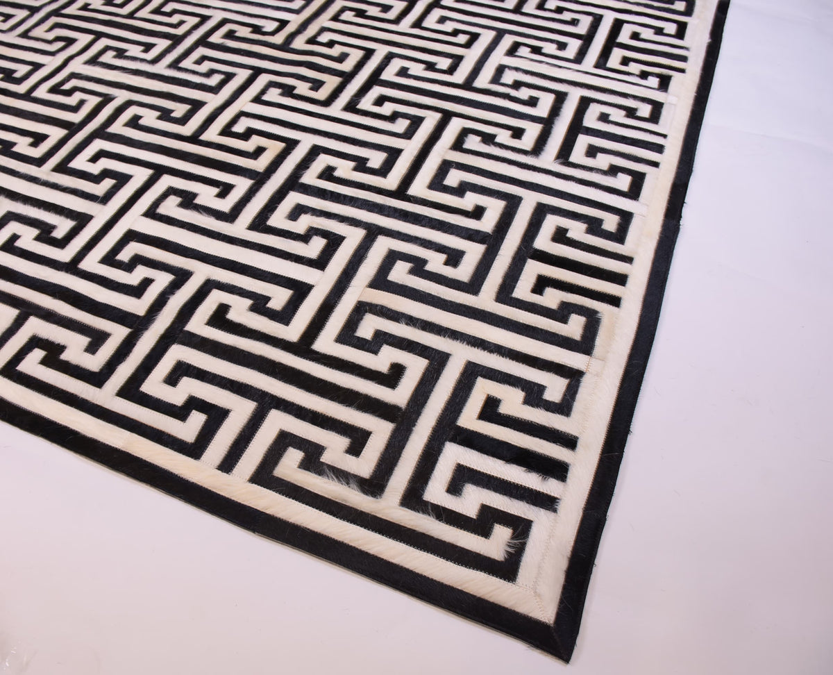 T Model – Maze-Inspired Cowhide Patch Rug by Homelosophy