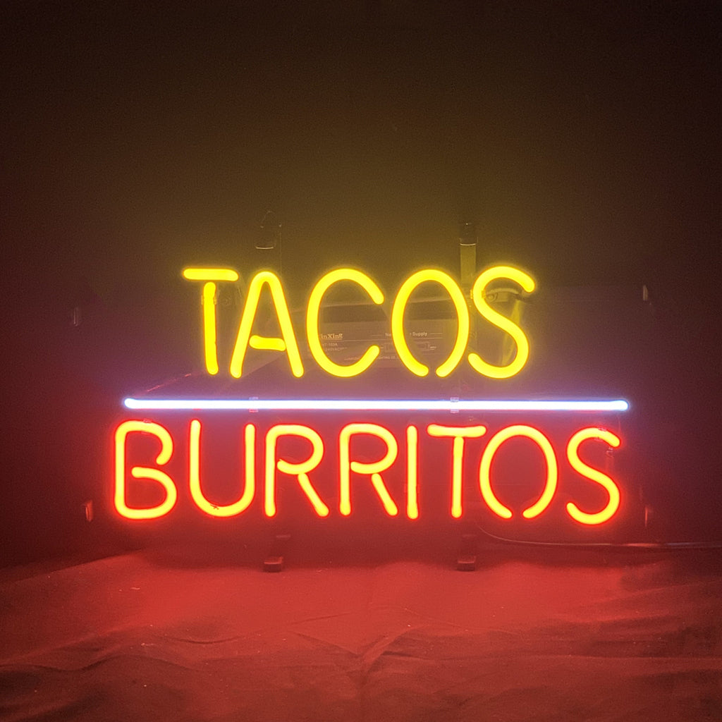 Tacos Burritos Neon Sign glowing bright on metal grid backing