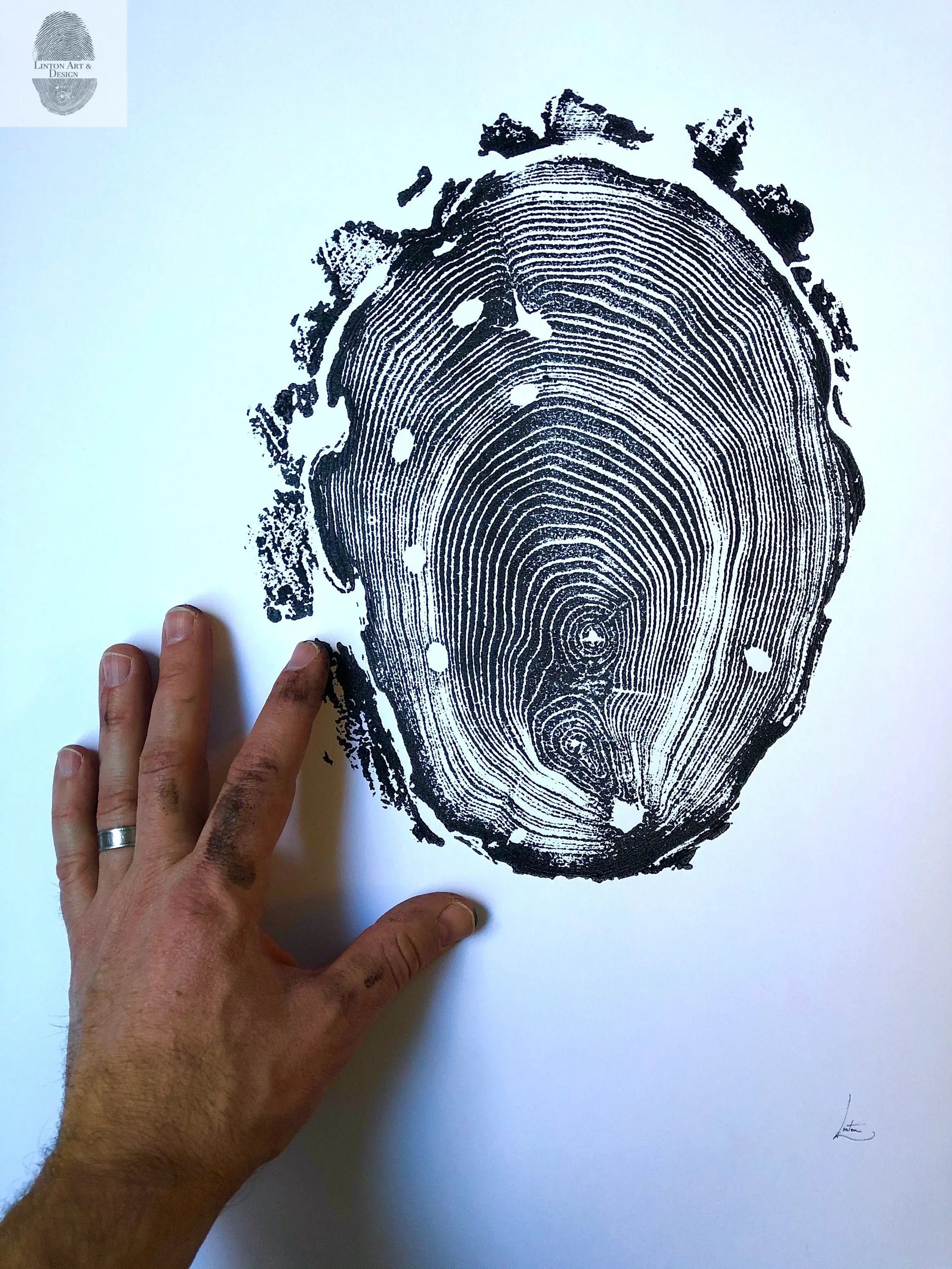 Walden Pond Print showing an 18x24 locust tree ring woodcut artwork by Erik Linton