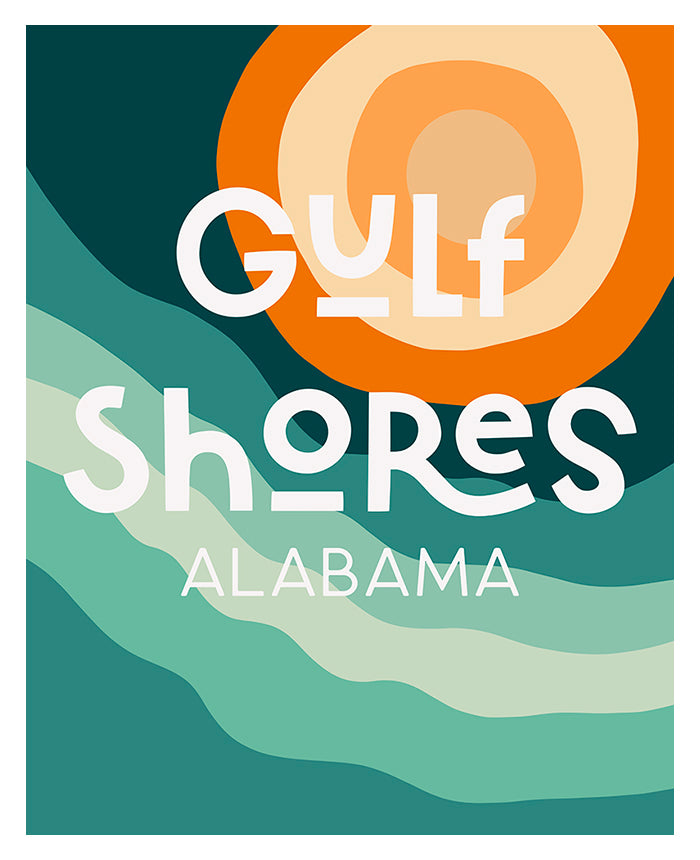 Framed modern typography art print 'Destination: Gulf Shores, Alabama' hanging on a white wall above a wooden sideboard.