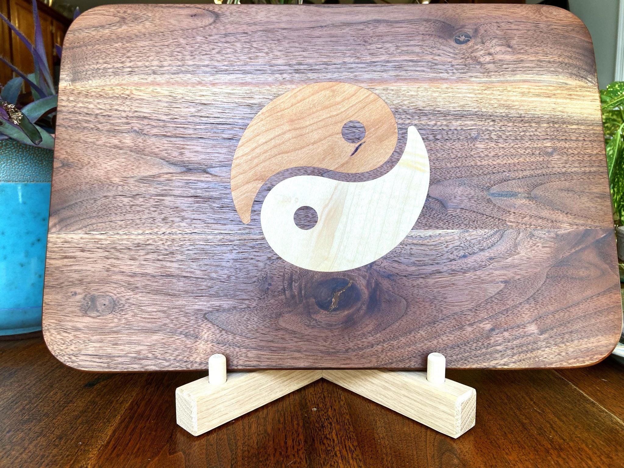 Walnut charcuterie board with Cherry and Maple Yin Yang wood inlay, handcrafted serving board