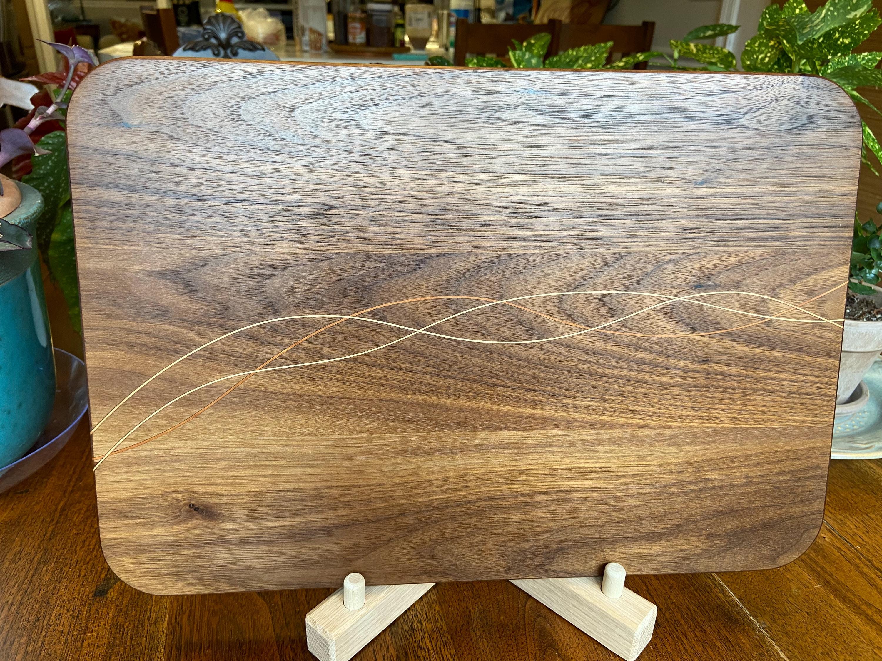 Handcrafted Walnut charcuterie board with Cherry and Maple decorative banding