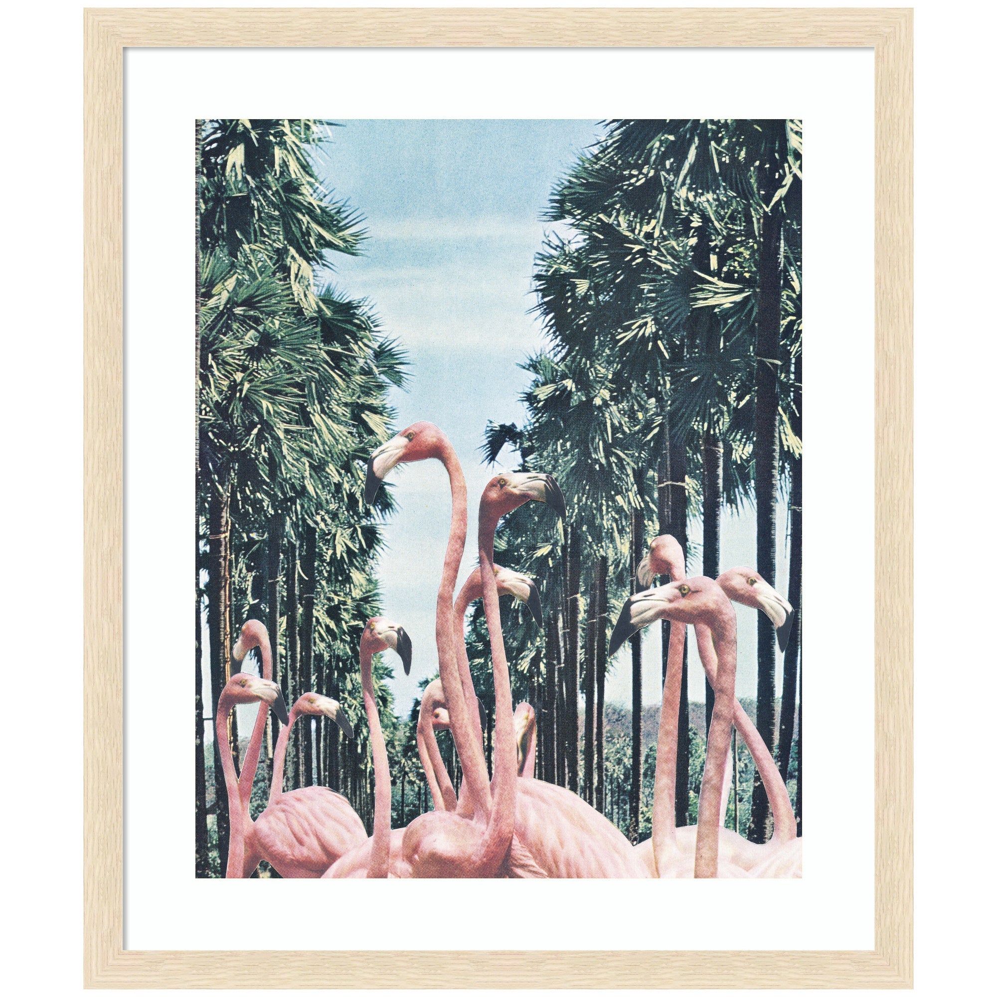 Framed art print showing pink flamingos standing among tall palm trees under a bright sky