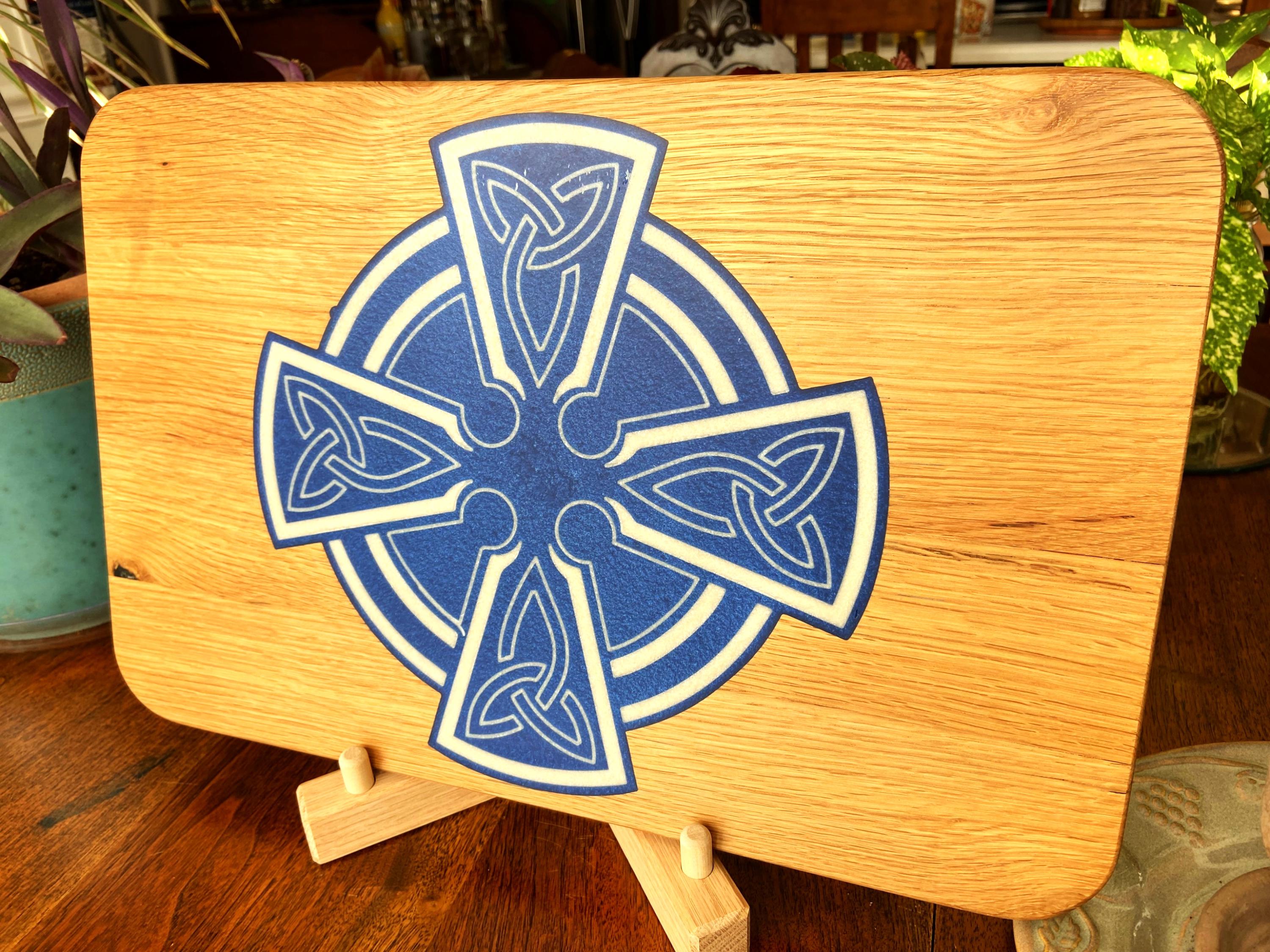 Handmade Celtic Cross charcuterie board in white oak with white on blue resin inlay