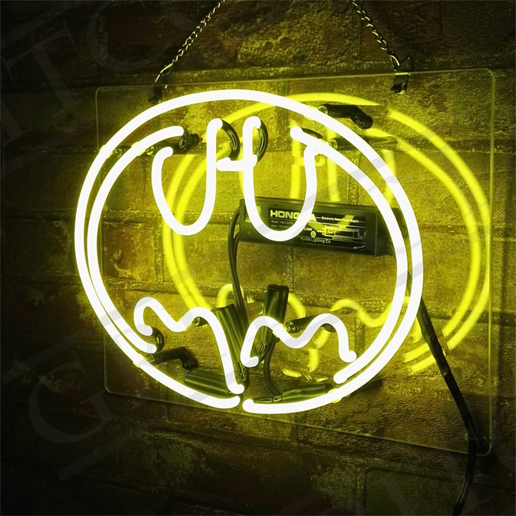 Illuminated Batman Neon Sign mounted on a white wall, glowing yellow and black tones