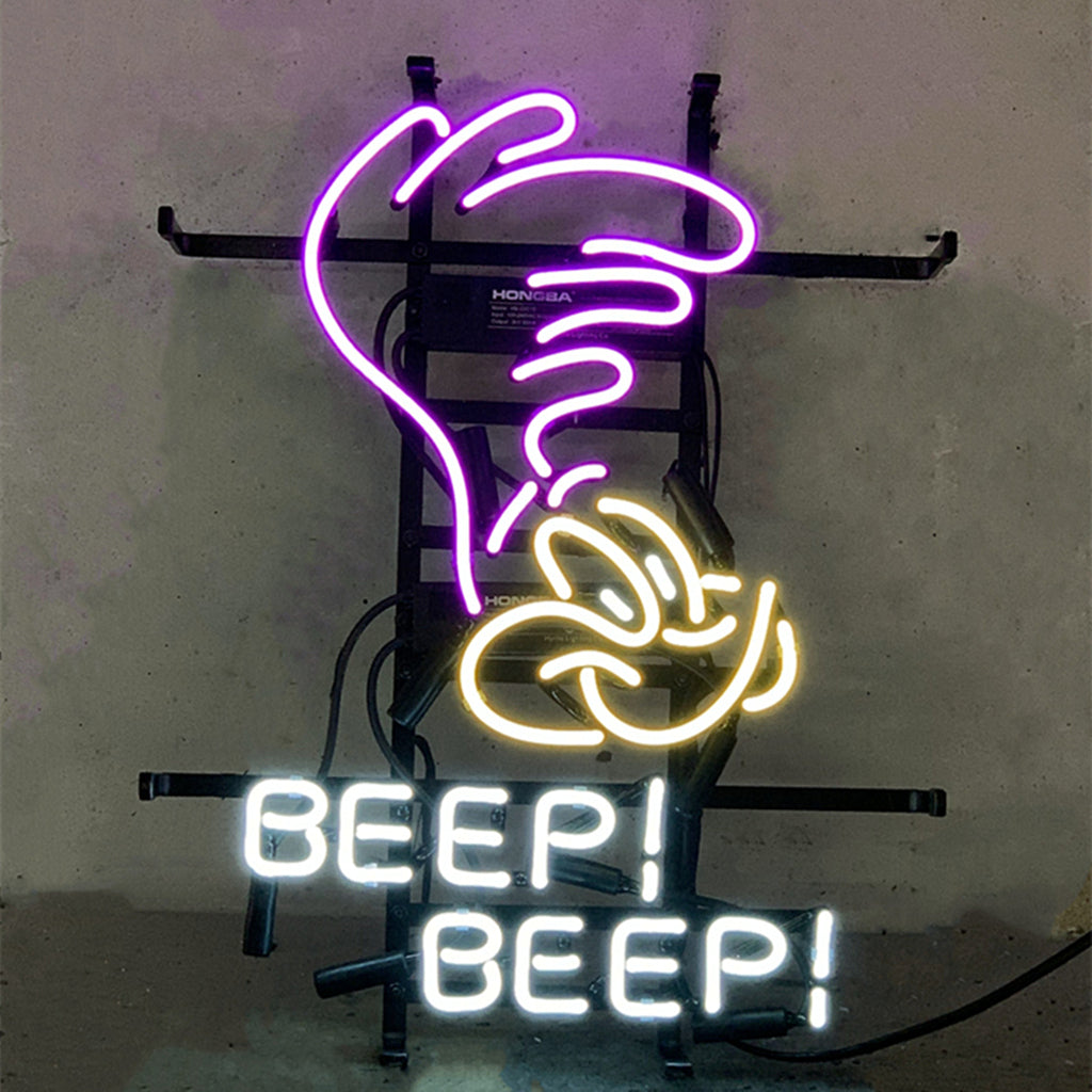 Brightly lit Plymouth Road Runner Superbird Beep Beep neon sign with red and blue glass tubes on metal grid backing.