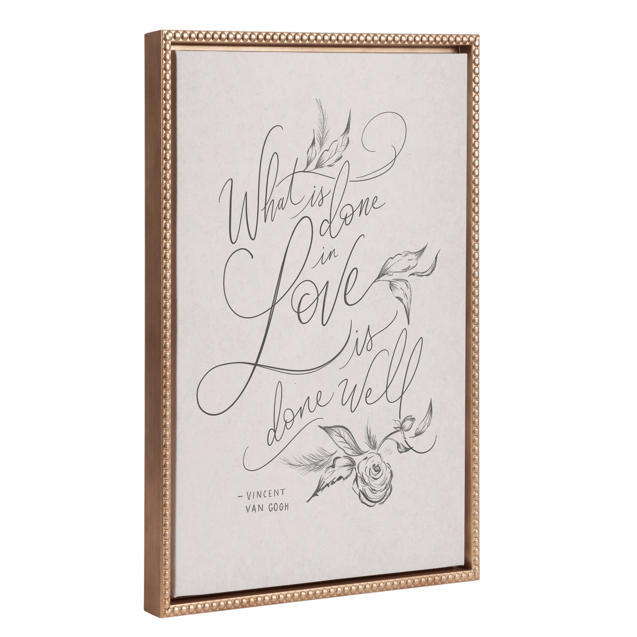 Framed canvas art with the quote 'What is Done in Love' in neutral tones and a vintage beaded gold frame
