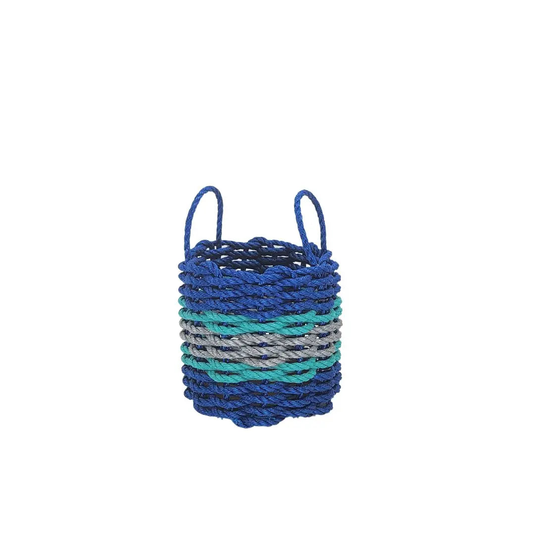 Handmade storage basket woven from blue, light gray, and teal lobster rope