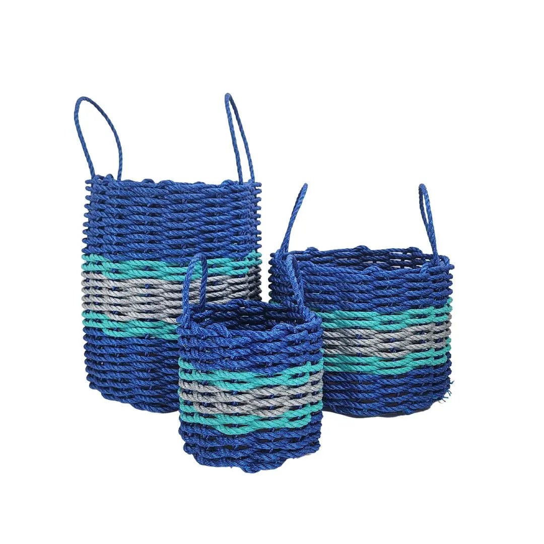Handmade storage basket woven from blue, light gray, and teal lobster rope