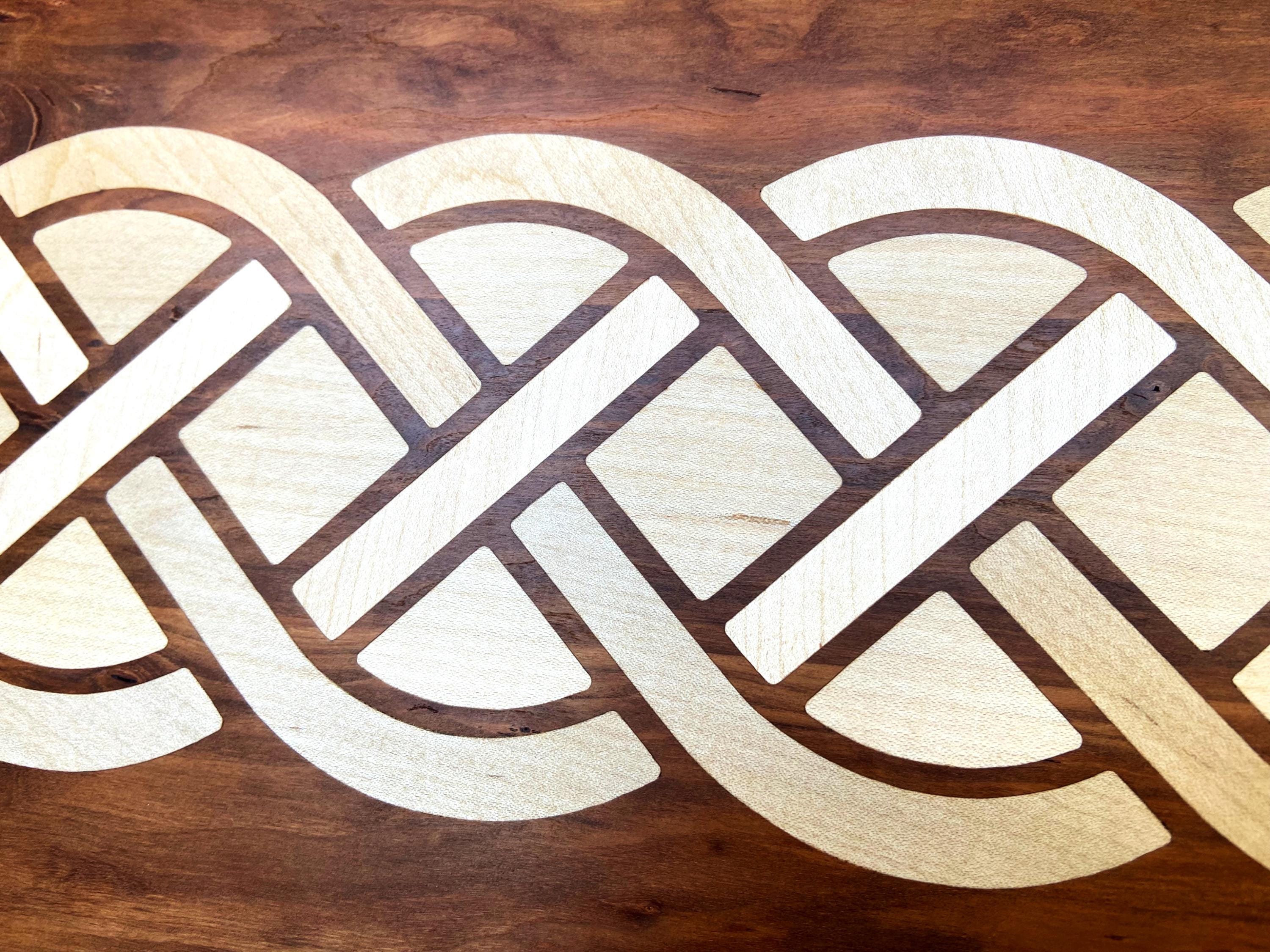 Cherry charcuterie board with complex Celtic knot inlay on White Oak wood