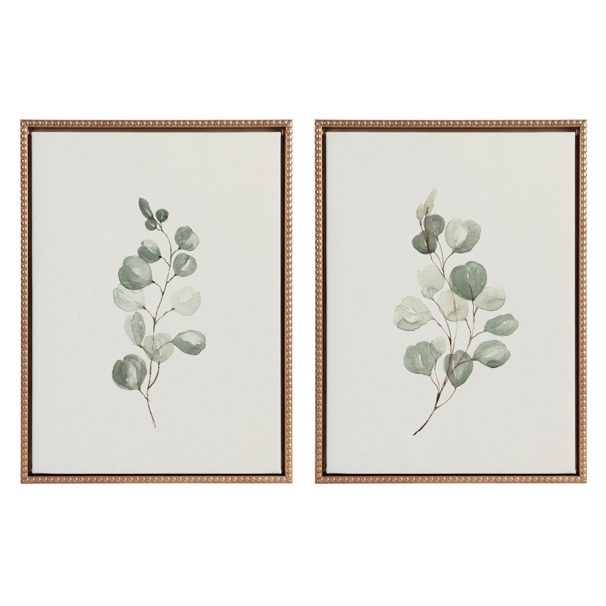 Two framed canvas eucalyptus prints with gold vintage beaded frames hung on white wall