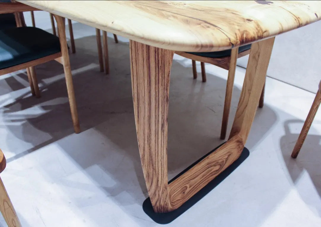 Rustic solid chestnut wood dining table with chestnut legs showing natural grain and knots