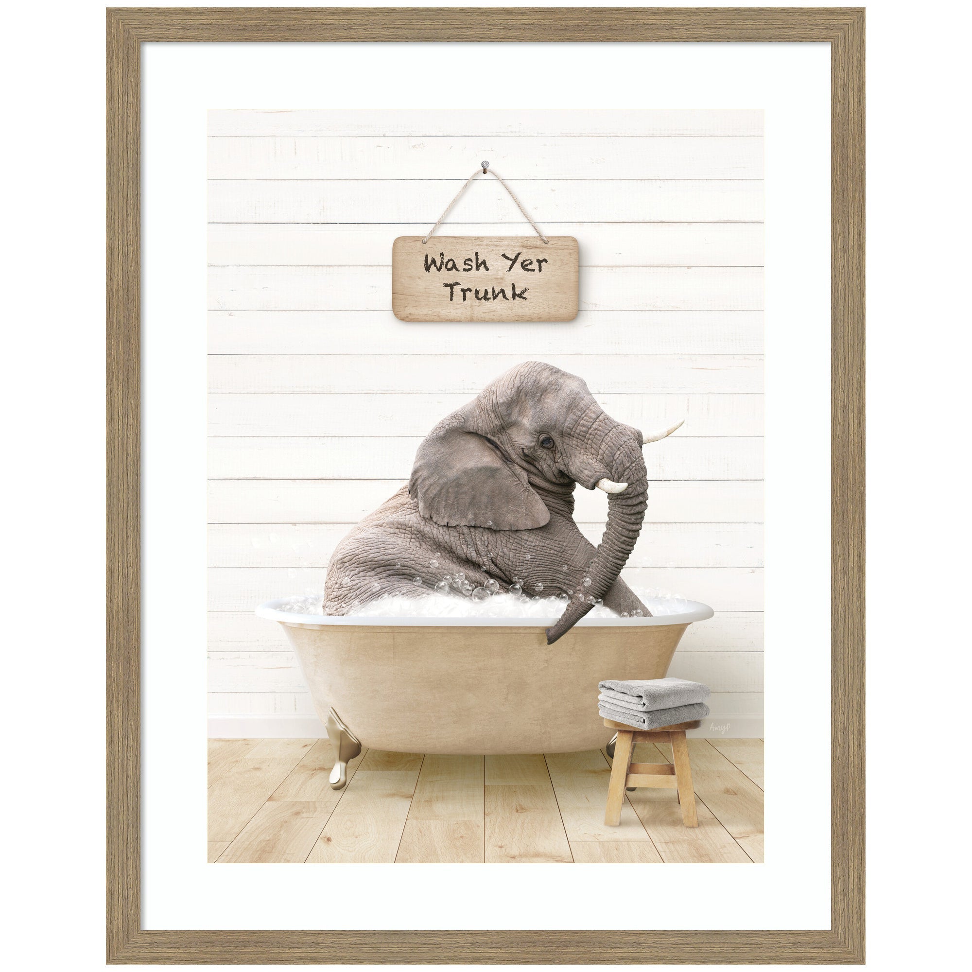 Framed wall art print of a young elephant sitting in a modern bathtub, surrounded by green tiled walls and bath accessories.