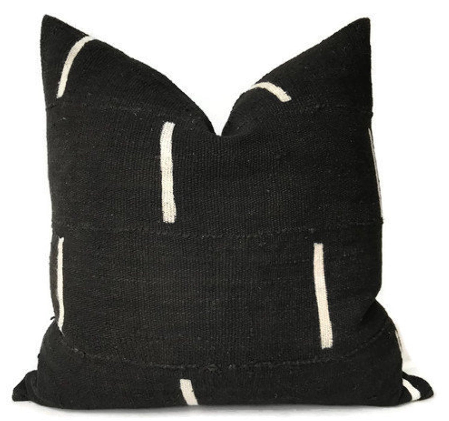 Dashes Print Mudcloth Pillow Cover in Black displayed on a light fabric background