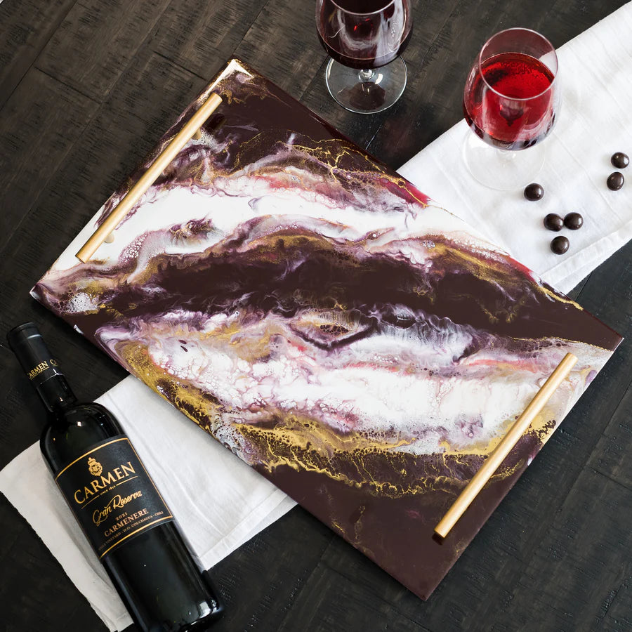 Marble-patterned Acrylic Resin Serving Tray with a bottle of Carmen wine and two glasses on a dark surface.
