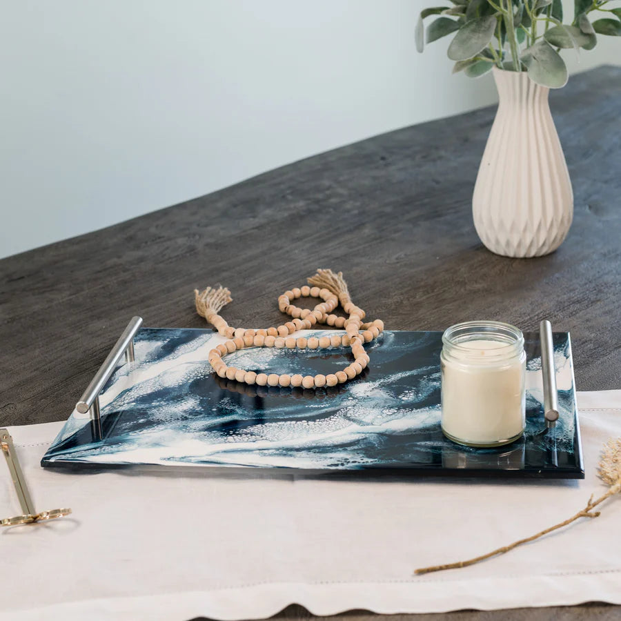 Decorative Acrylic Resin Serving Tray with candle, beads, and vase on a table