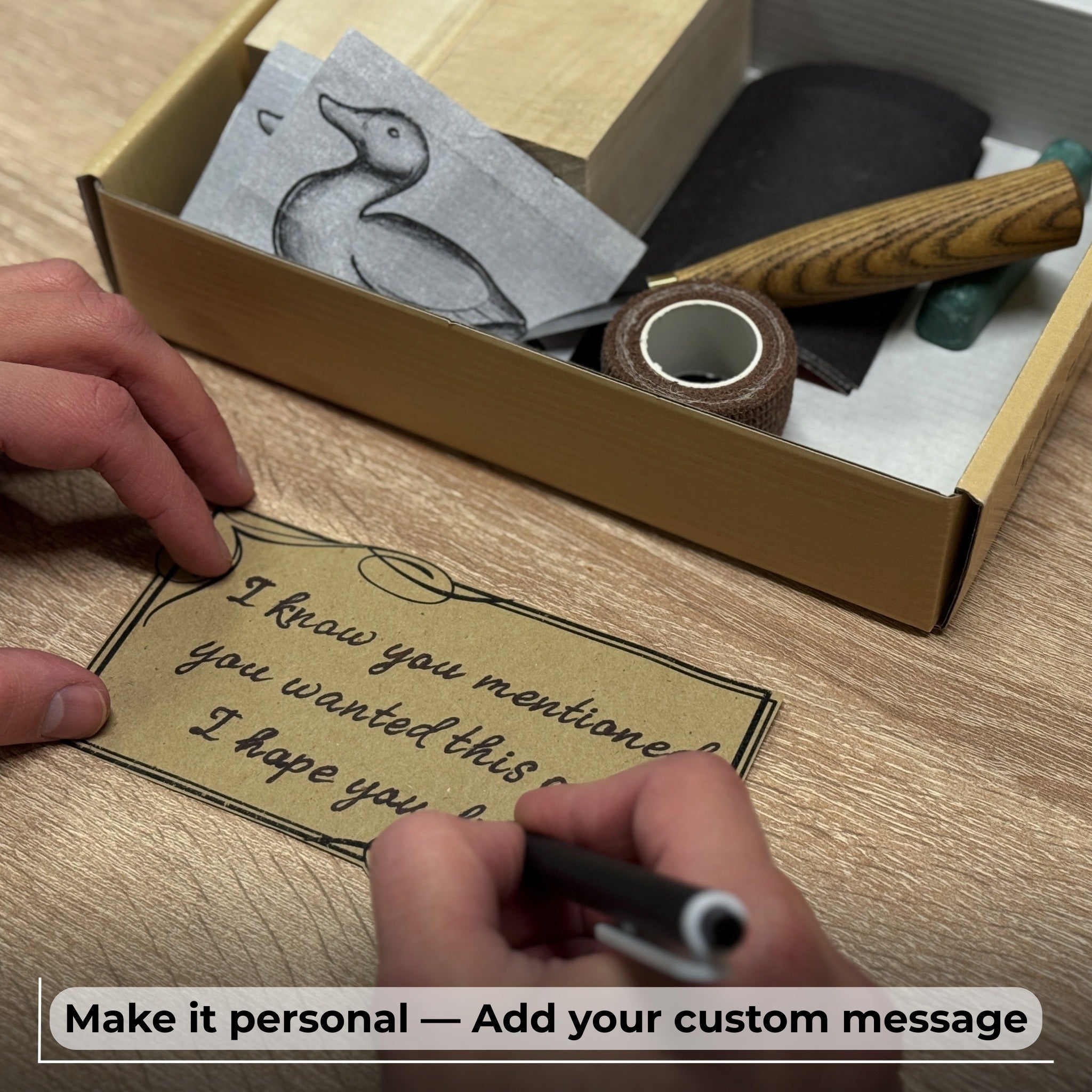 Complete Duck Carving Kit with knife, wooden blocks, sandpaper, sharpening board, pencil, and duck drawing guide
