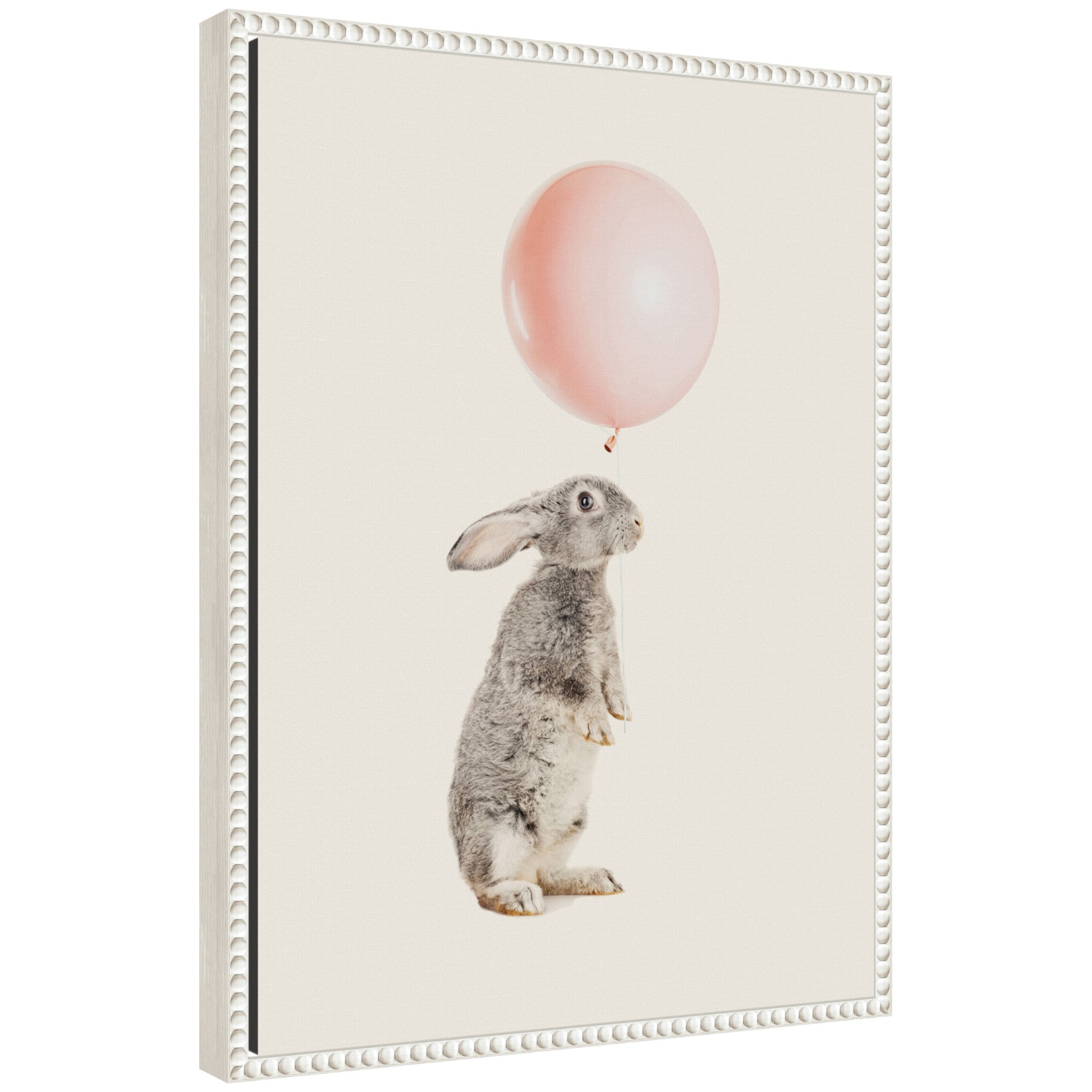 Framed canvas art titled 'Sylvie The Bunny and the Pink Balloon' showing a bunny holding a pink balloon, with a vintage beaded frame