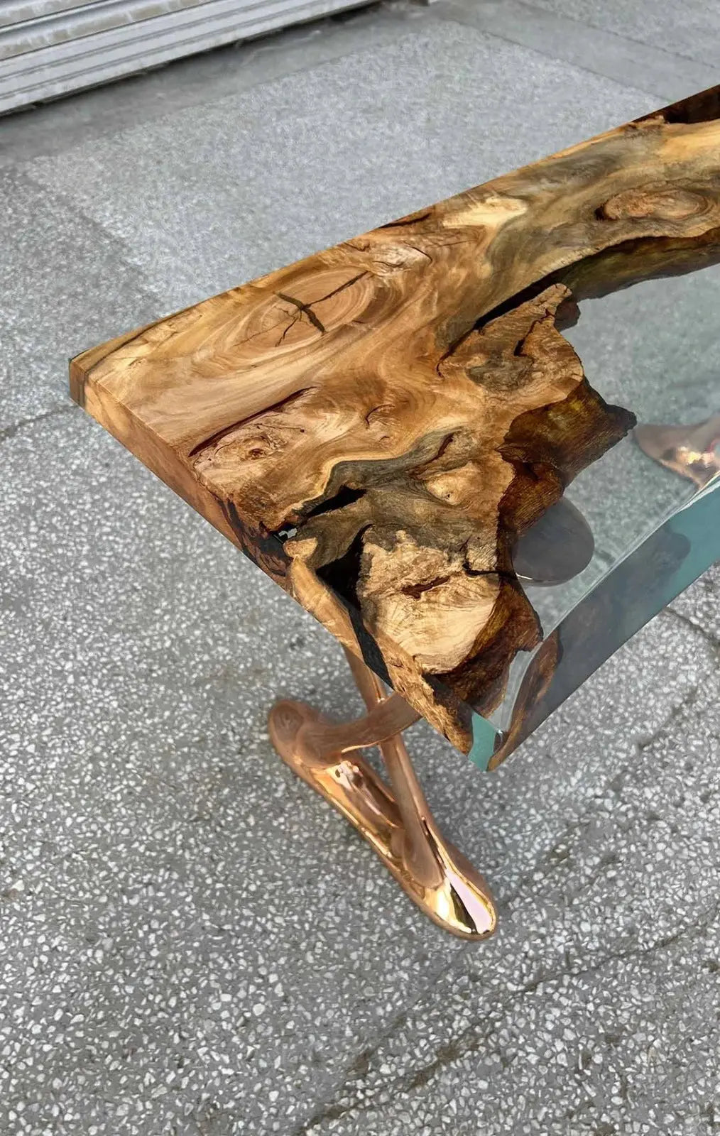 Handcrafted resin live edge console table made of aged linden wood with aluminum legs in a foyer setting