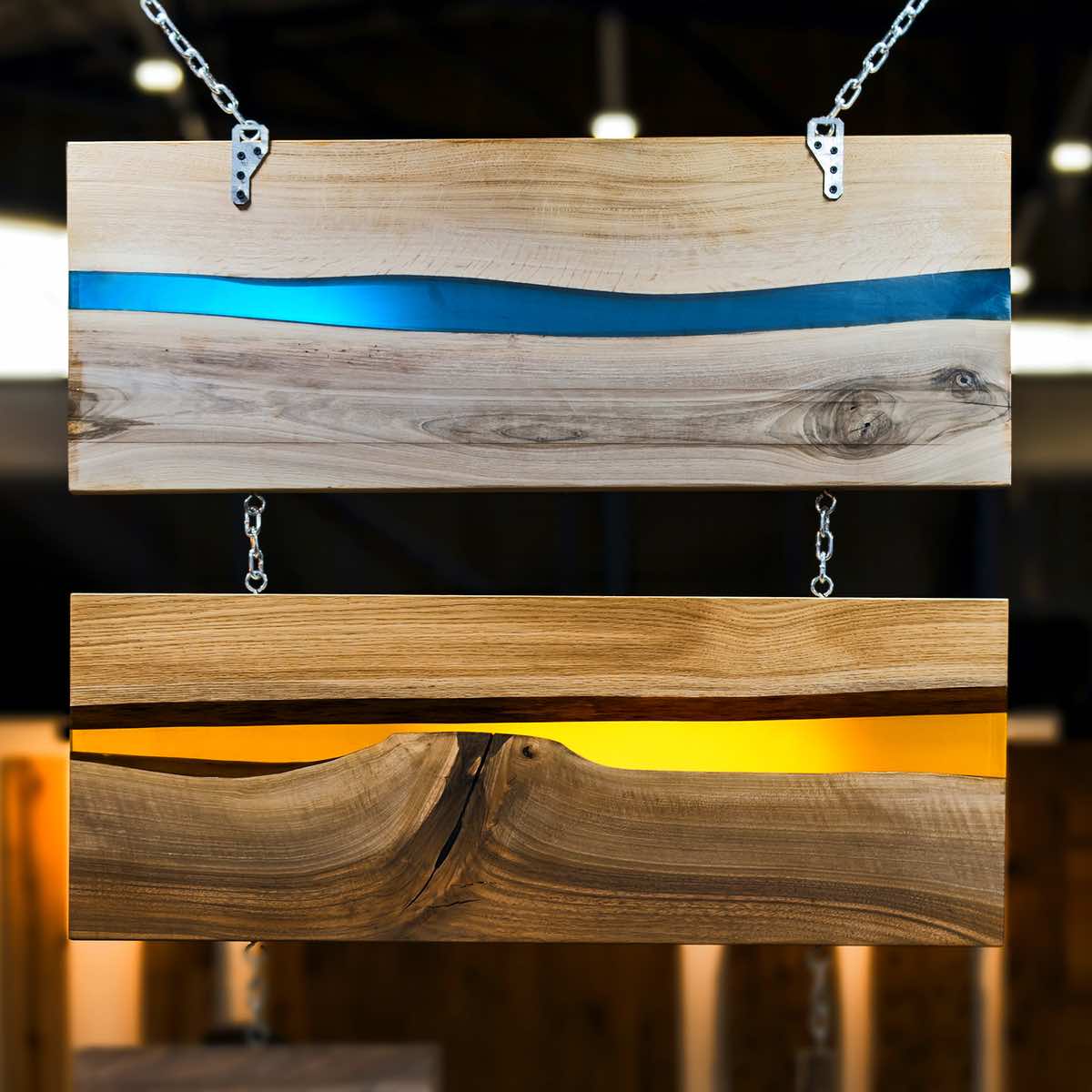 Wooden sign with blue and gold stripes on a blurred background