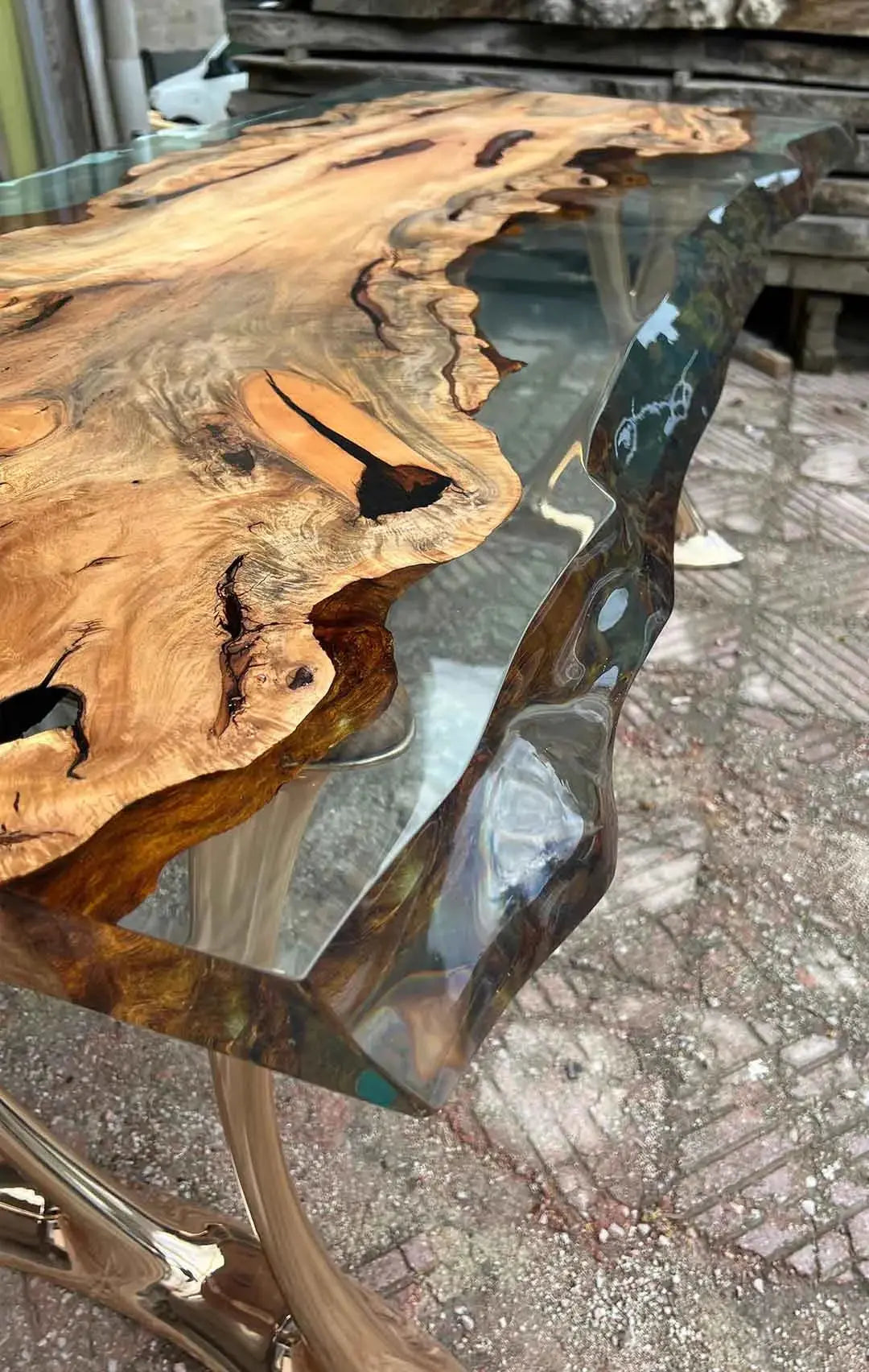 Handcrafted resin live edge console table made of aged linden wood with aluminum legs in a foyer setting