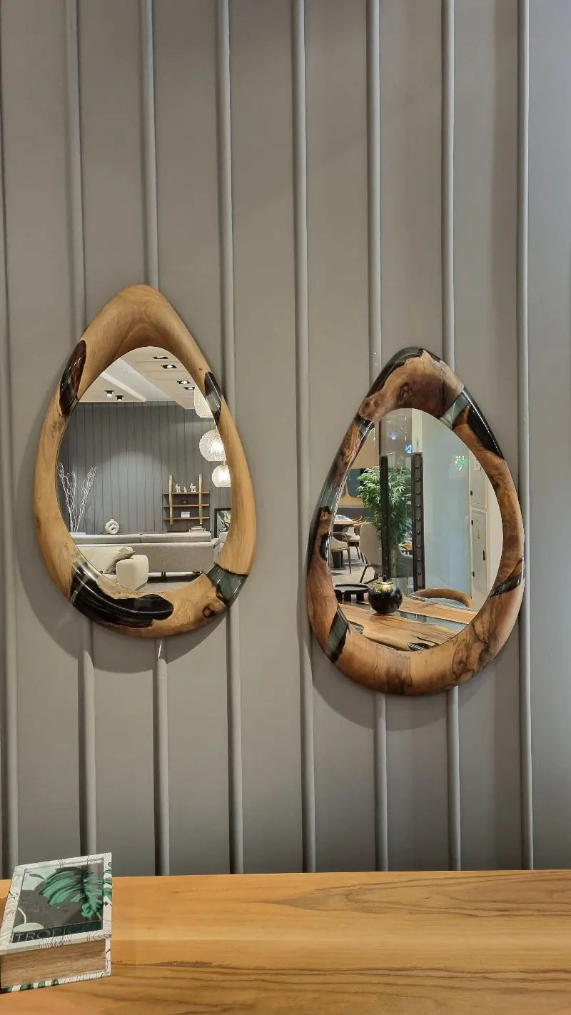 Handcrafted epoxy resin and walnut mirrors in round and teardrop shapes