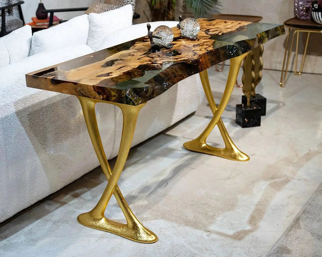 Handcrafted resin live edge console table made of aged linden wood with aluminum legs in a foyer setting