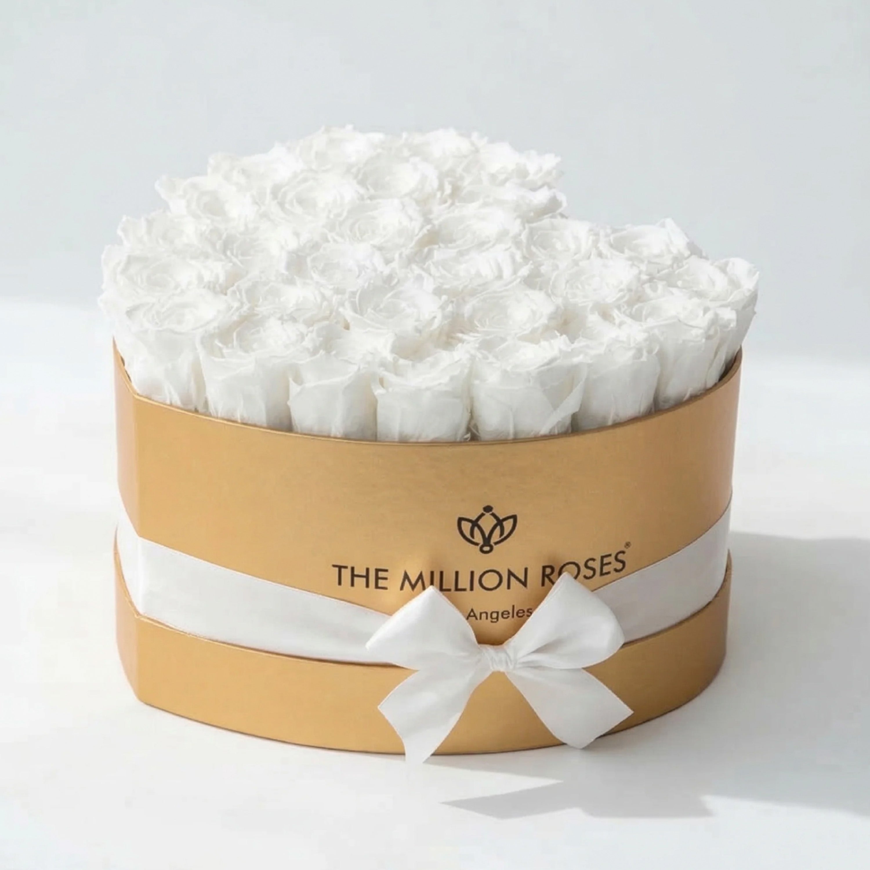 Heart shaped gold box filled with 28-30 hand-formed white roses