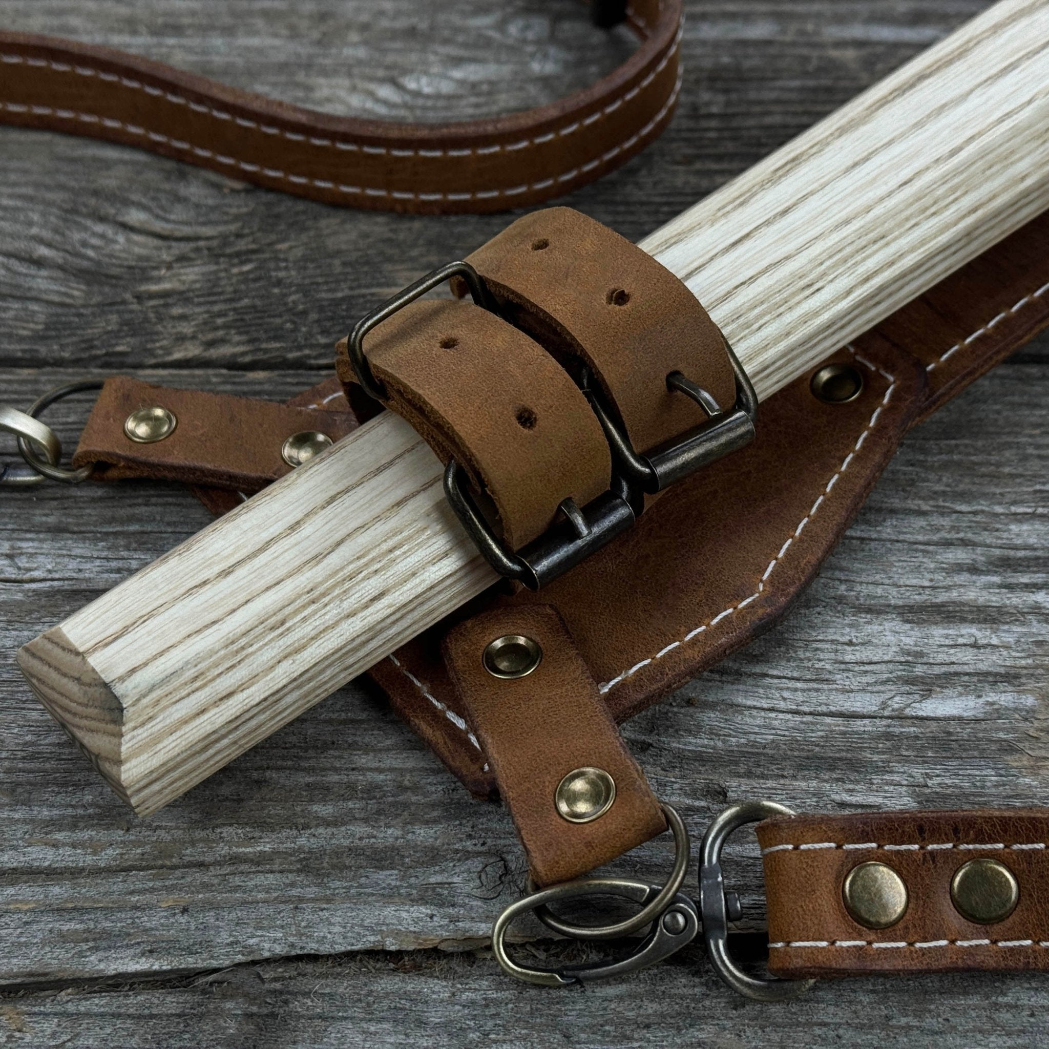 Hand-forged bushcraft hatchet with leather back sheath and ash handle