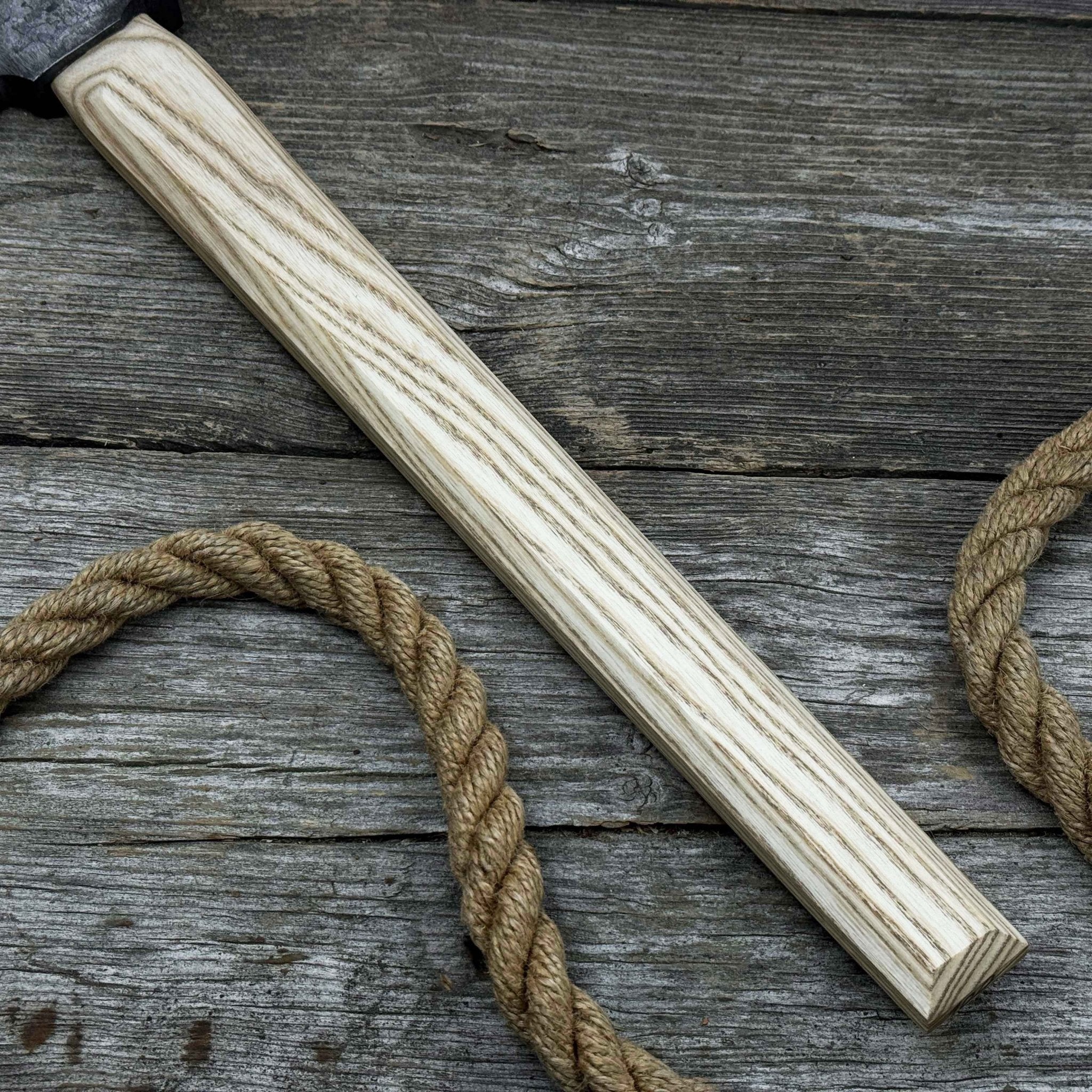 Hand-forged bushcraft hatchet with leather back sheath and ash handle