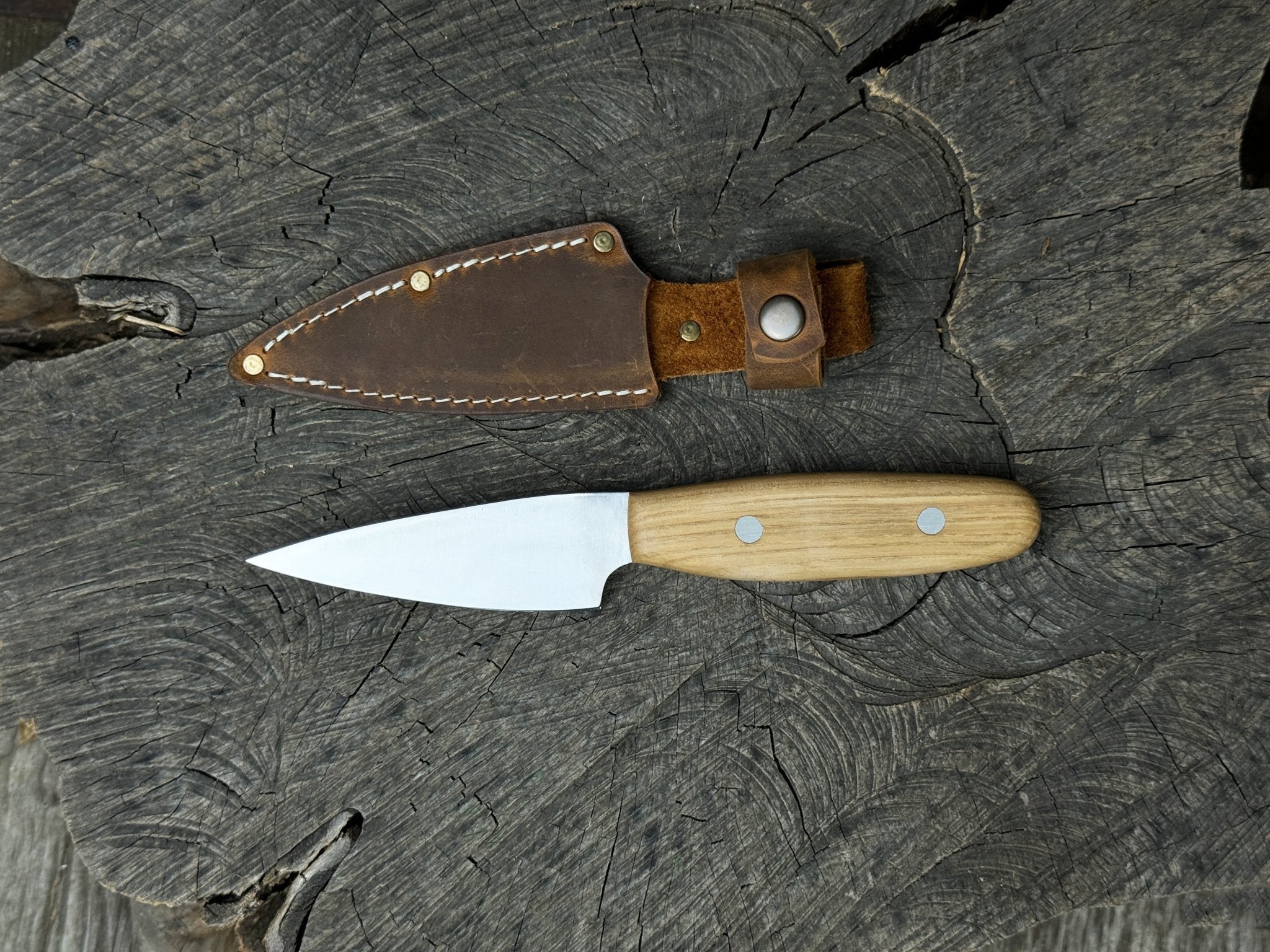Hand-Forged Bushcraft Knife with 10 cm carbon steel blade and ash wood handle