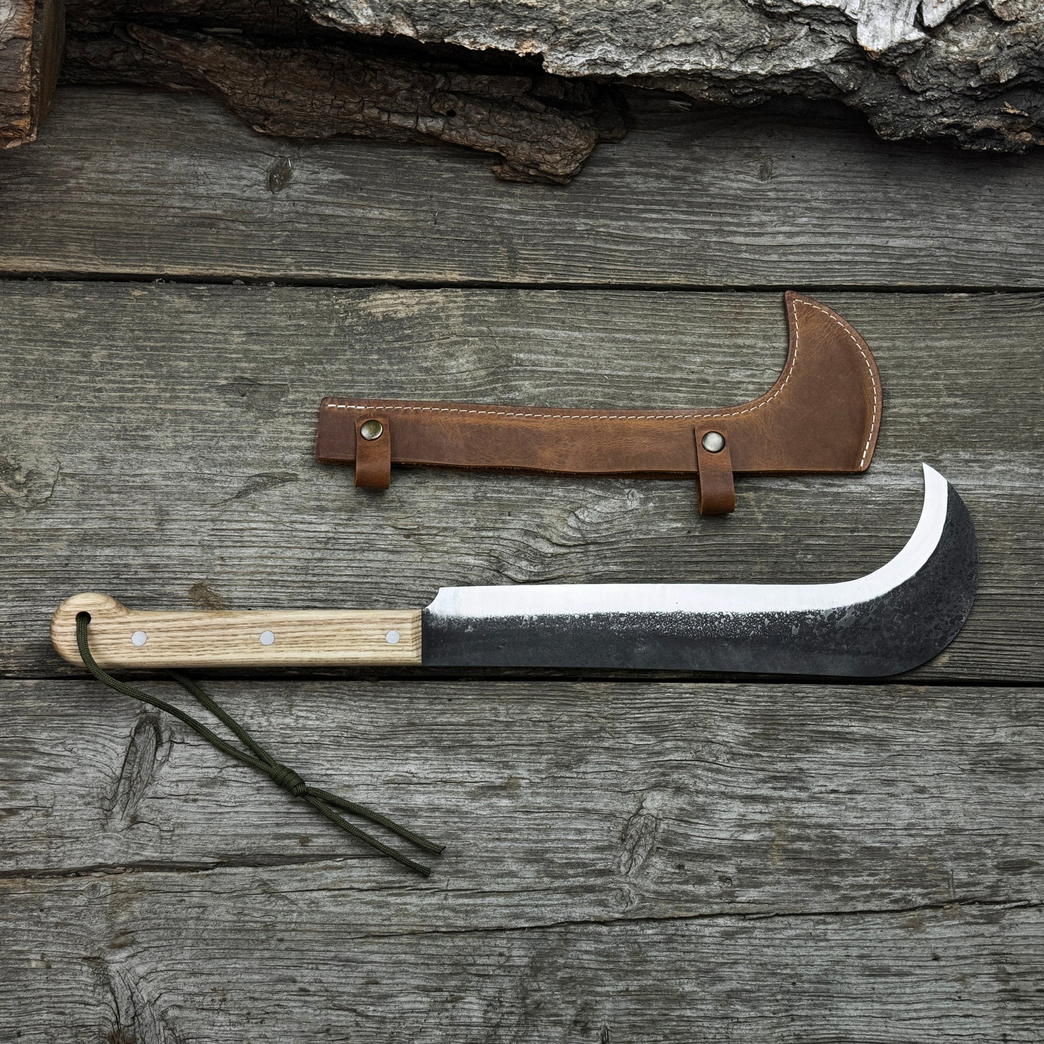 Hand-forged bushcraft knife with carbon steel blade and ash wood handle by Sharky Forged Steel Tools