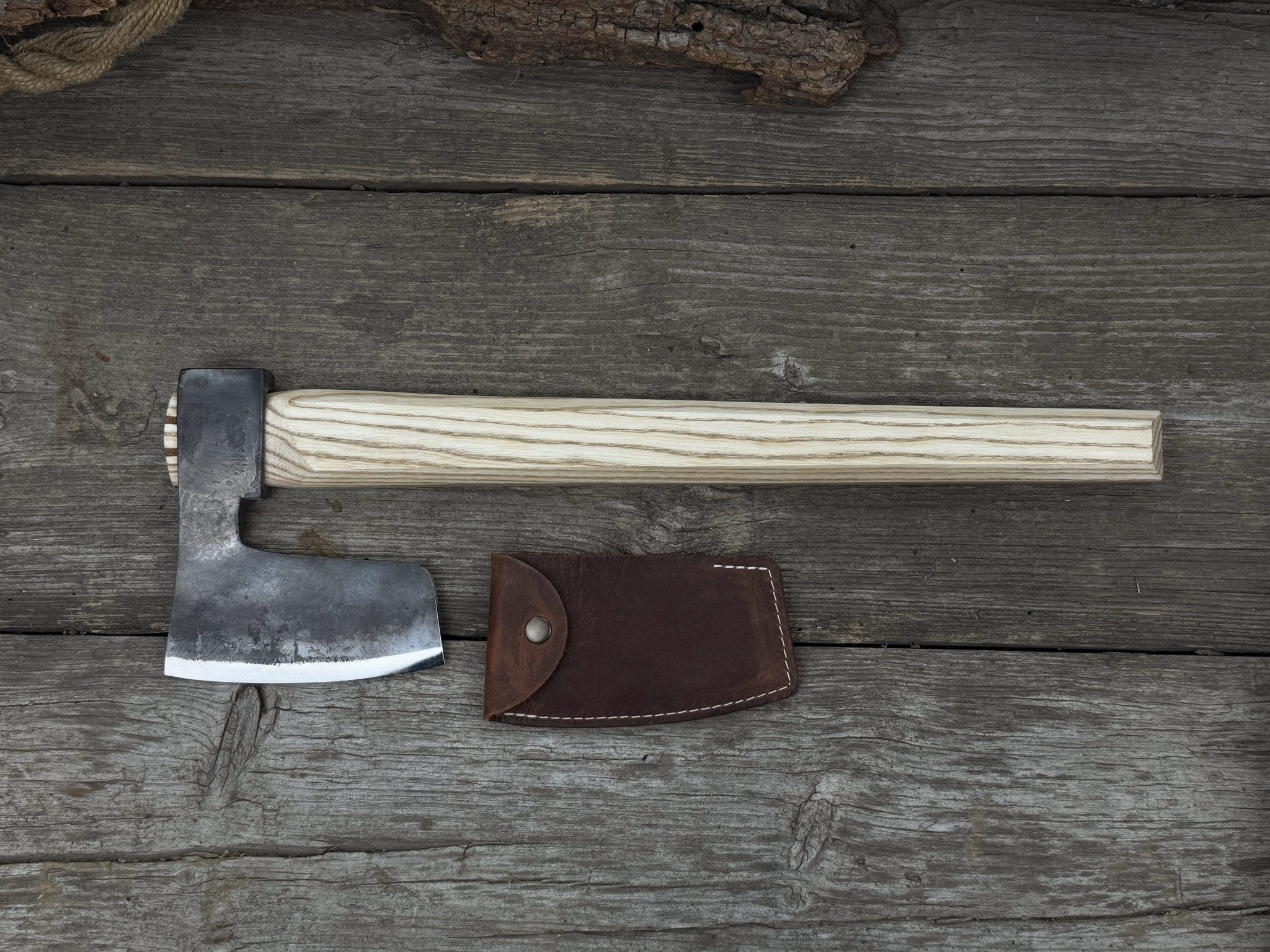 Hand-forged carpenter's axe with belt loop and leather sheath