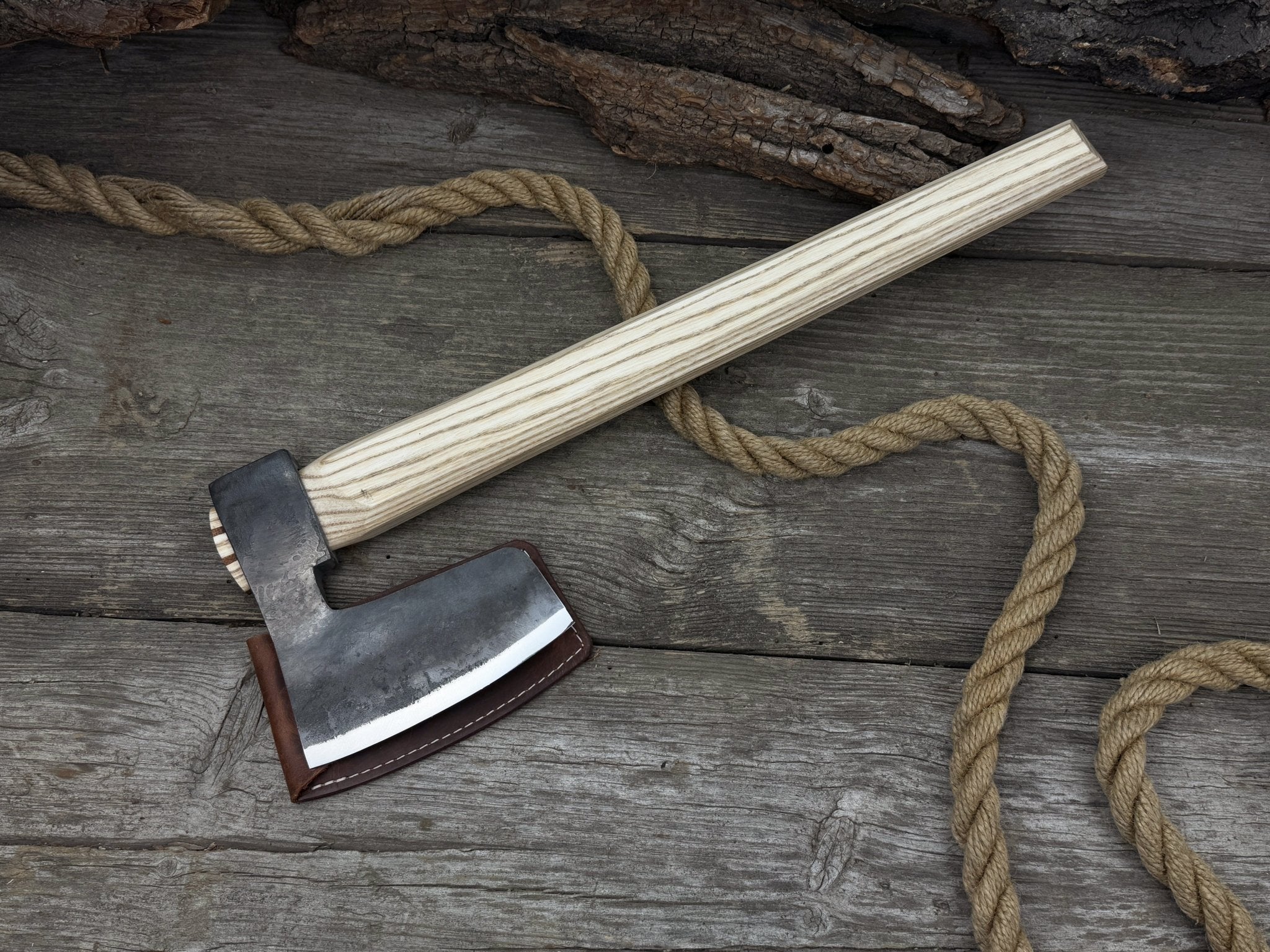 Hand-forged carpenter's axe with belt loop and leather sheath