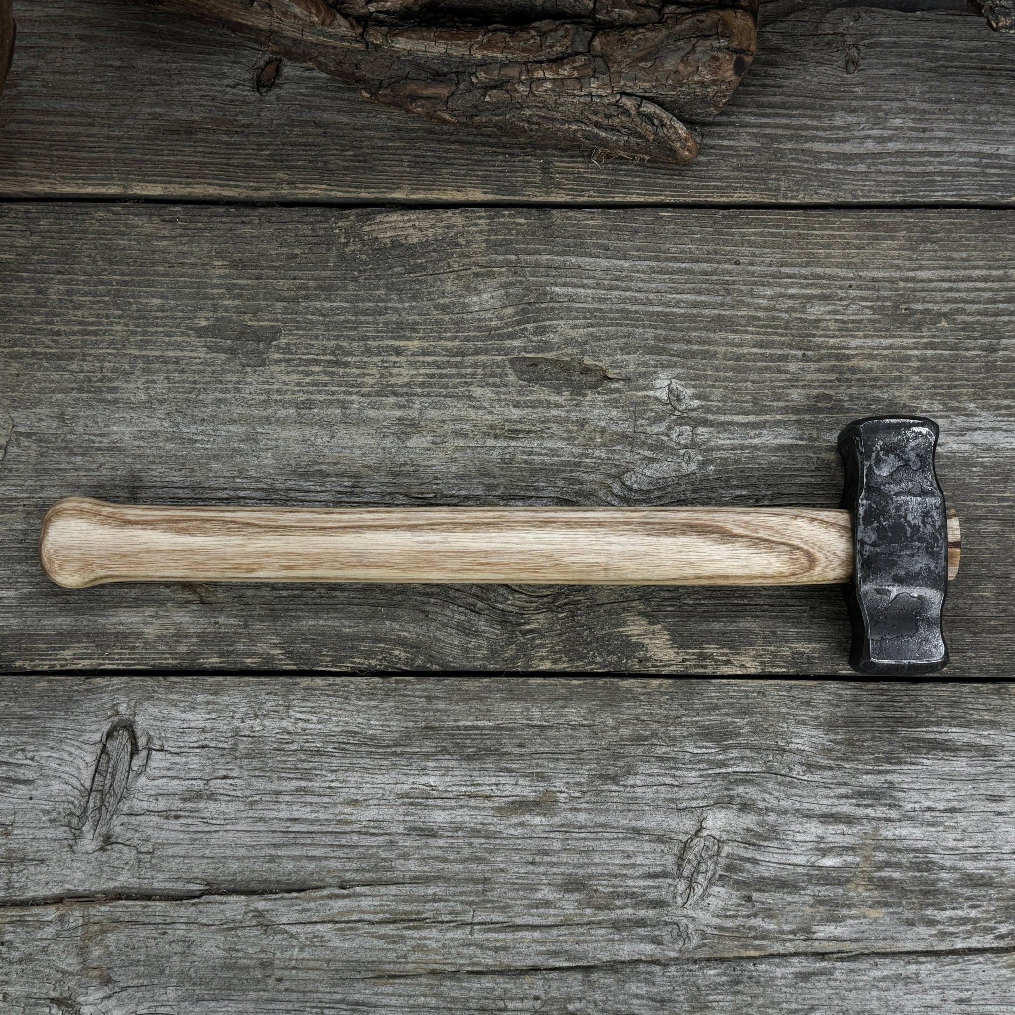 Hand-forged double blacksmith's hammer with ash wood handle and carbon steel head