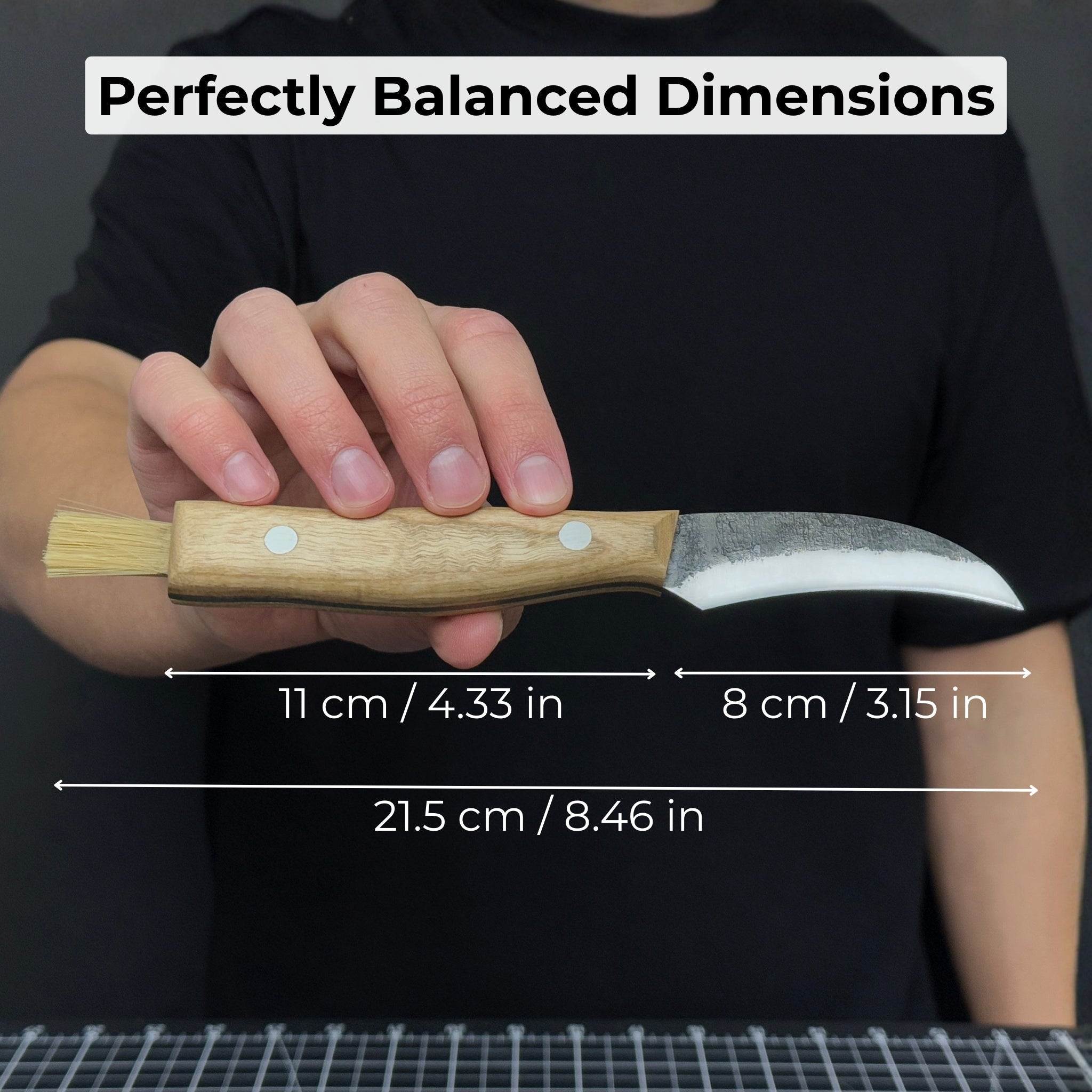 Hand-forged mushroom foraging knife with carbon steel blade, ash wood handle, built-in brush, and leather sheath