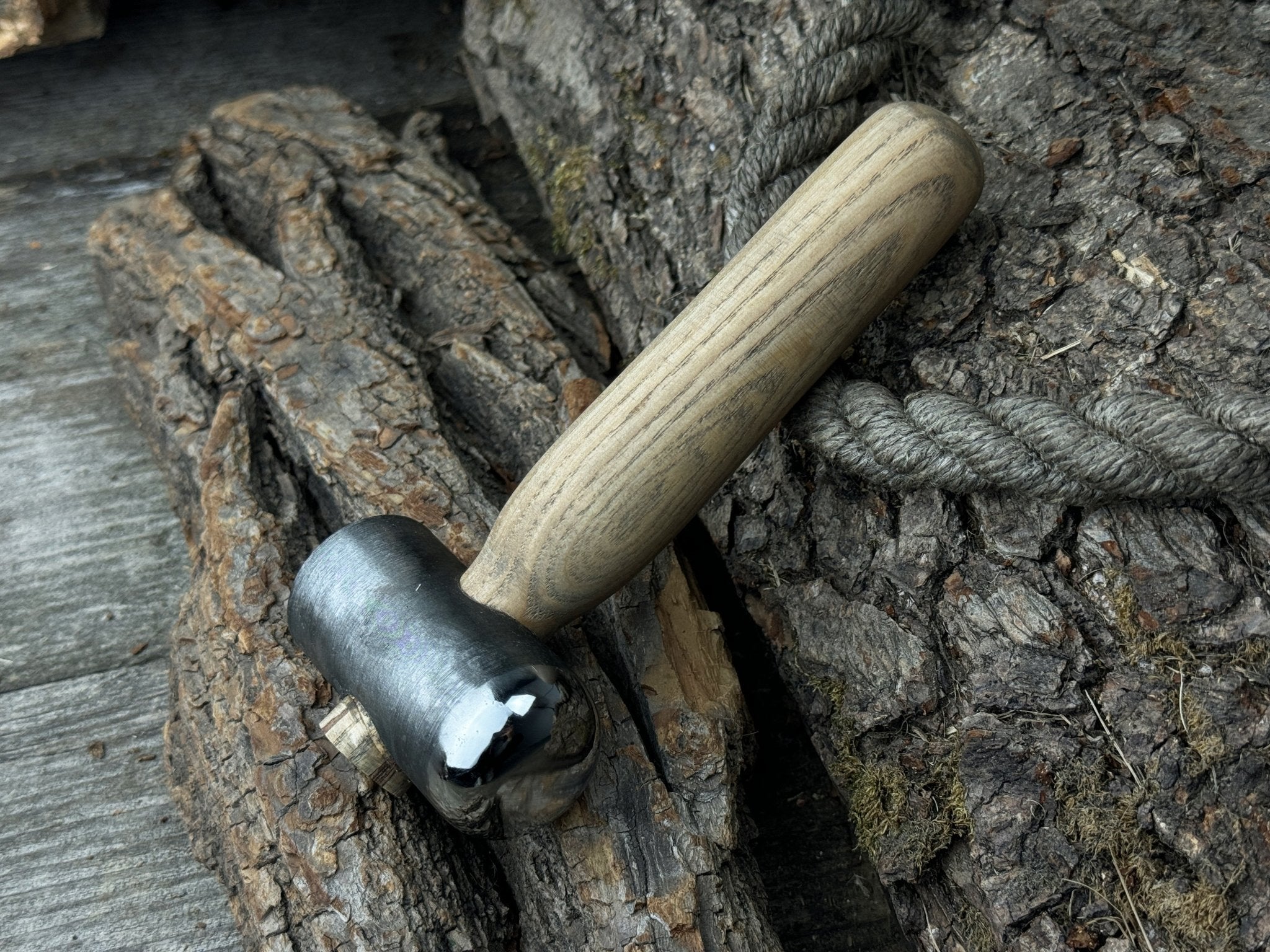 Hand-forged leather hammer with carbon steel head and ash wood handle