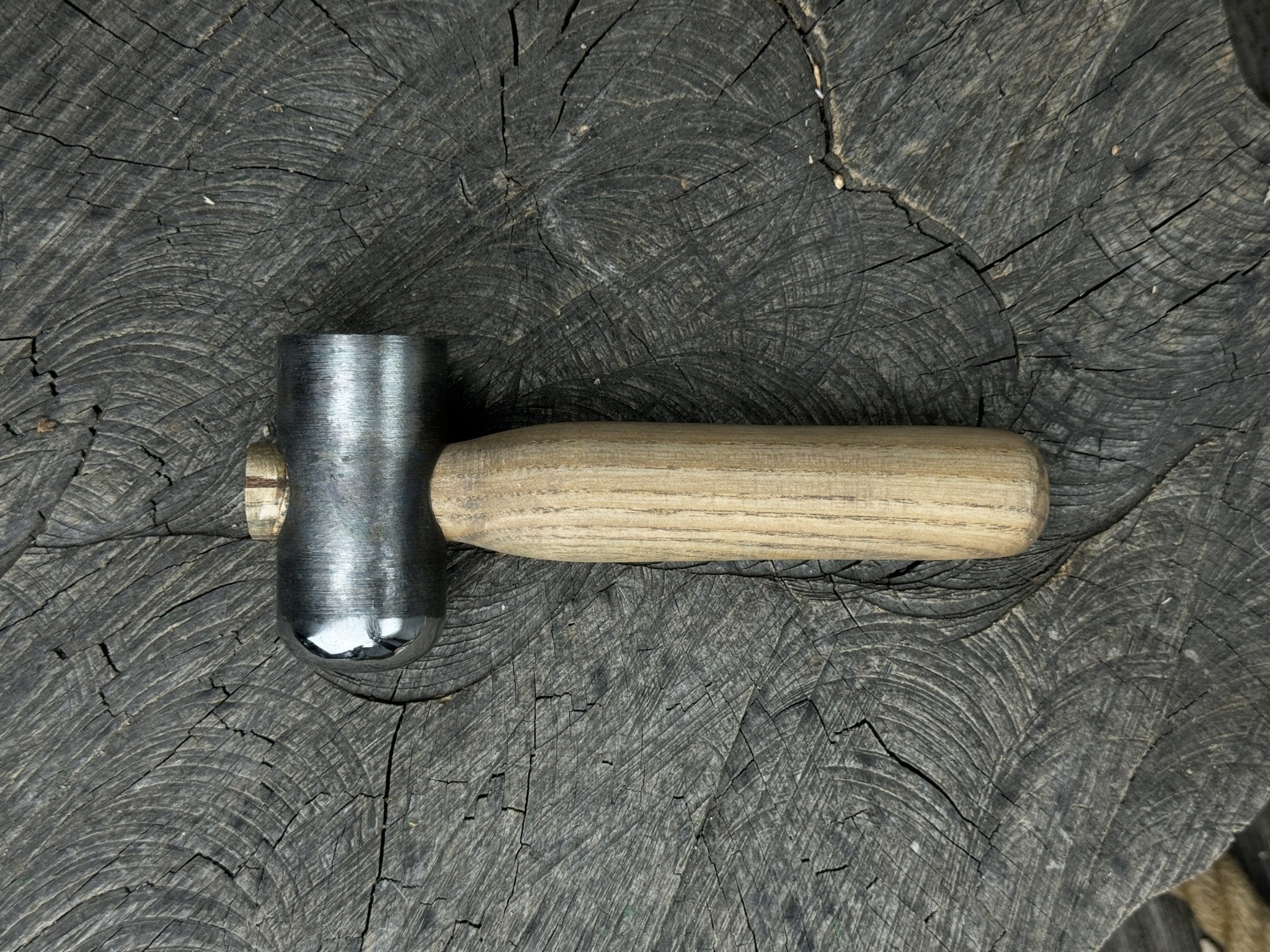 Hand-forged leather hammer with carbon steel head and ash wood handle