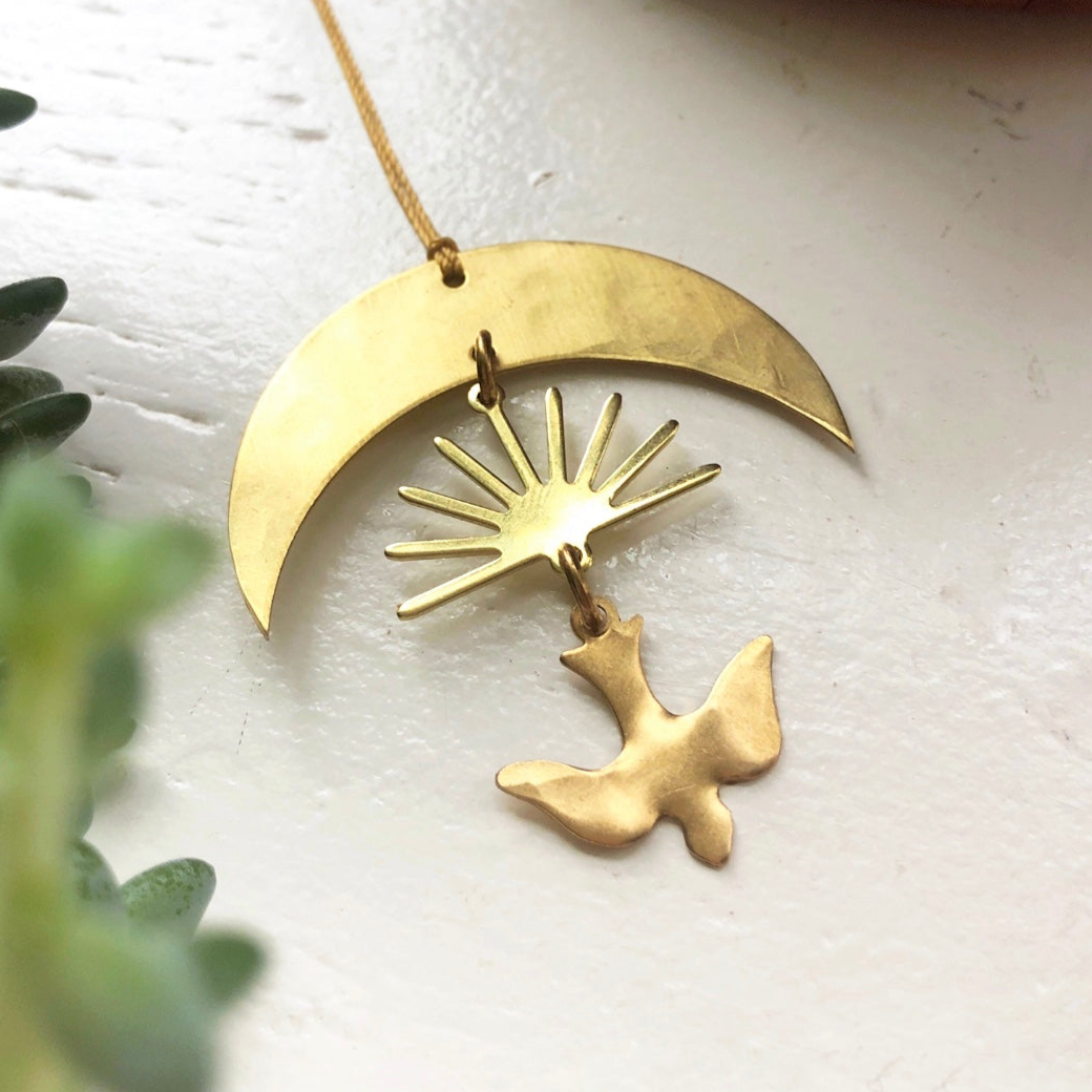 Brass Shalom Ornament hand-cut and hammered, hanging on twine