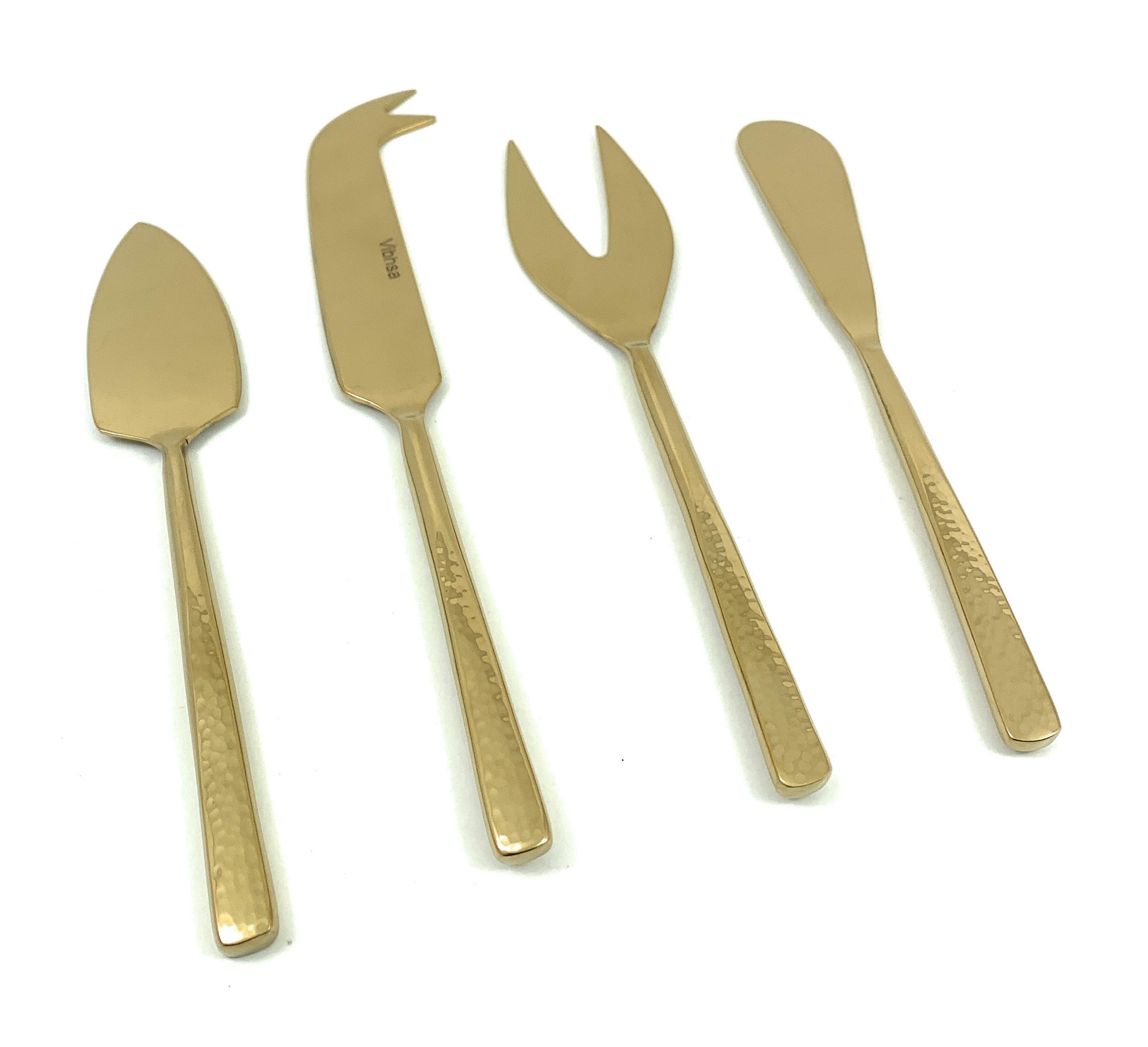 Set of 4 stainless steel cheese knives with golden hammered handles displayed on wood surface