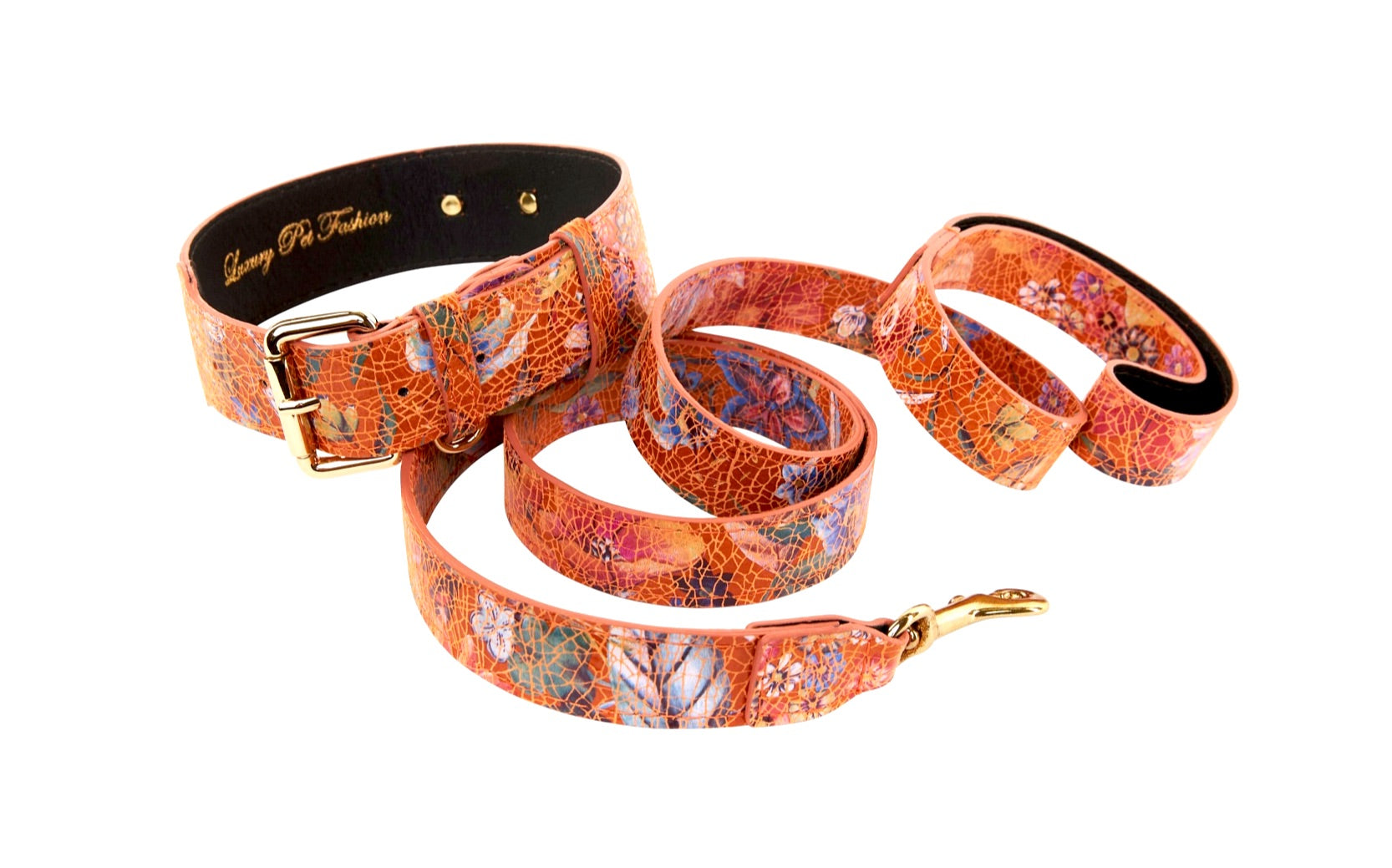 Orange floral patterned Italian leather dog collar and leash set laid out flat