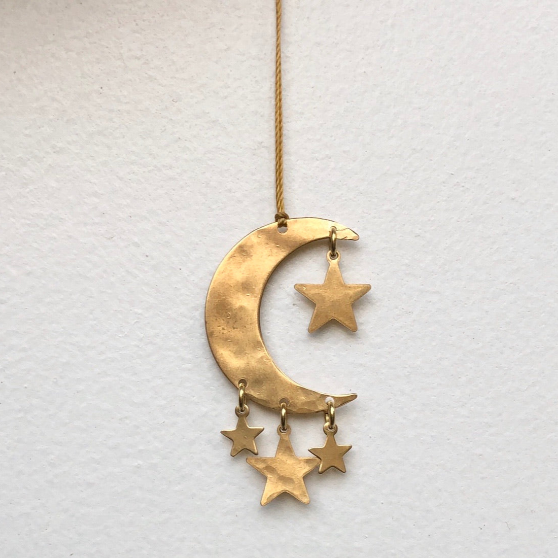 Written in the Stars Ornament, hand-cut and hammered brass celestial wall hanging by Vida + Luz.