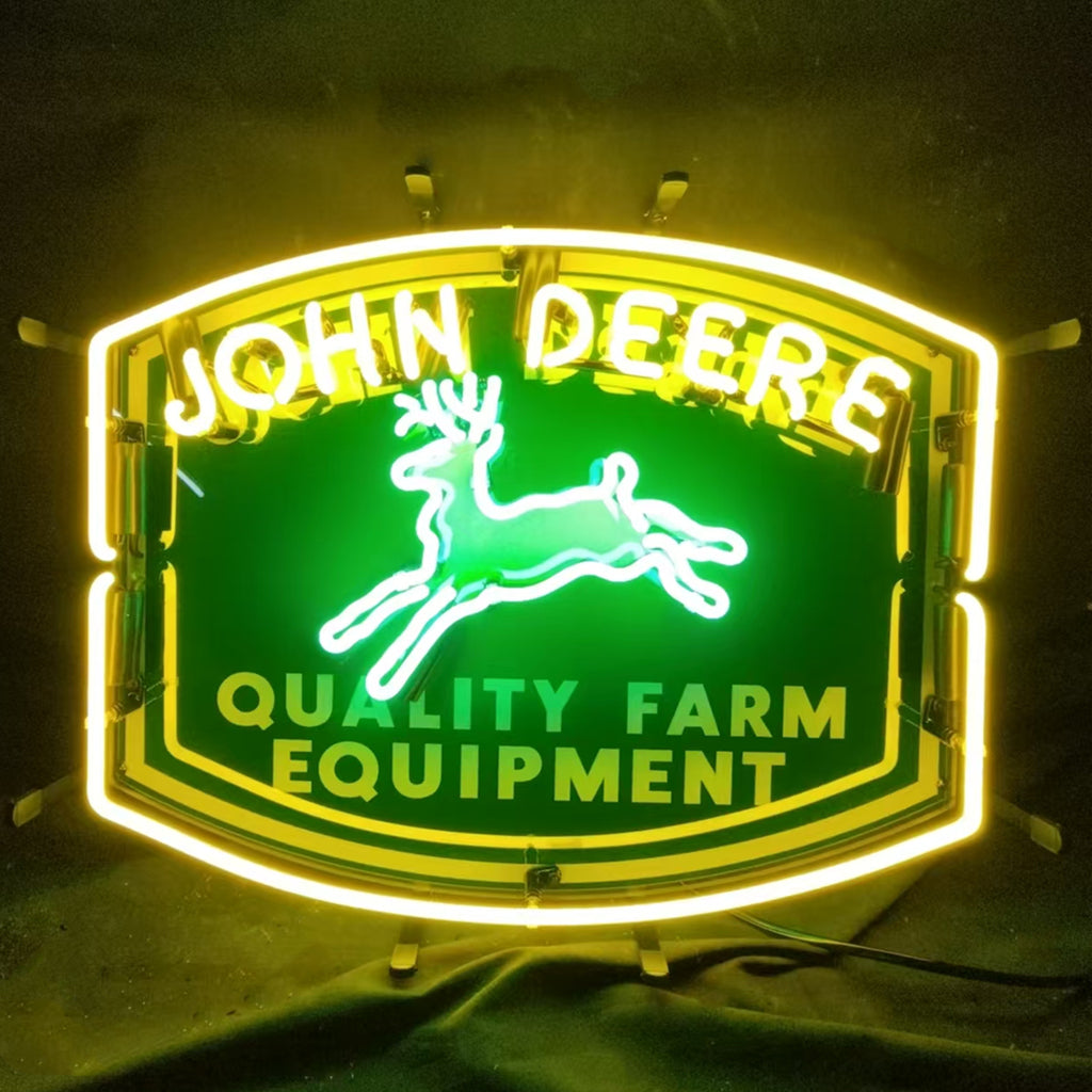 John Deere Quality Farm Equipment Neon Sign illuminated on metal grid backing