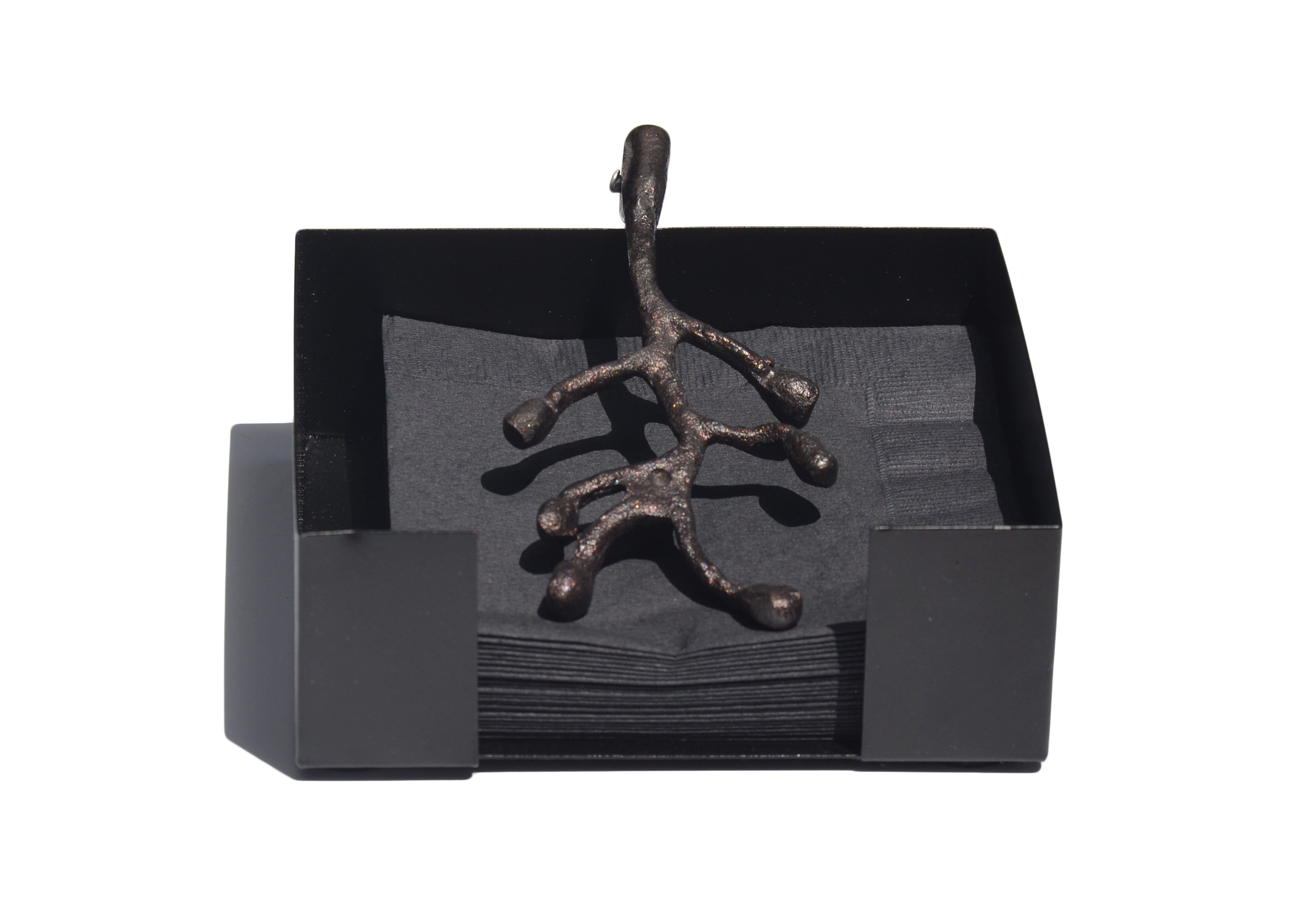 Vibhsa napkin holder featuring an antique flower bud design displayed on a wooden table