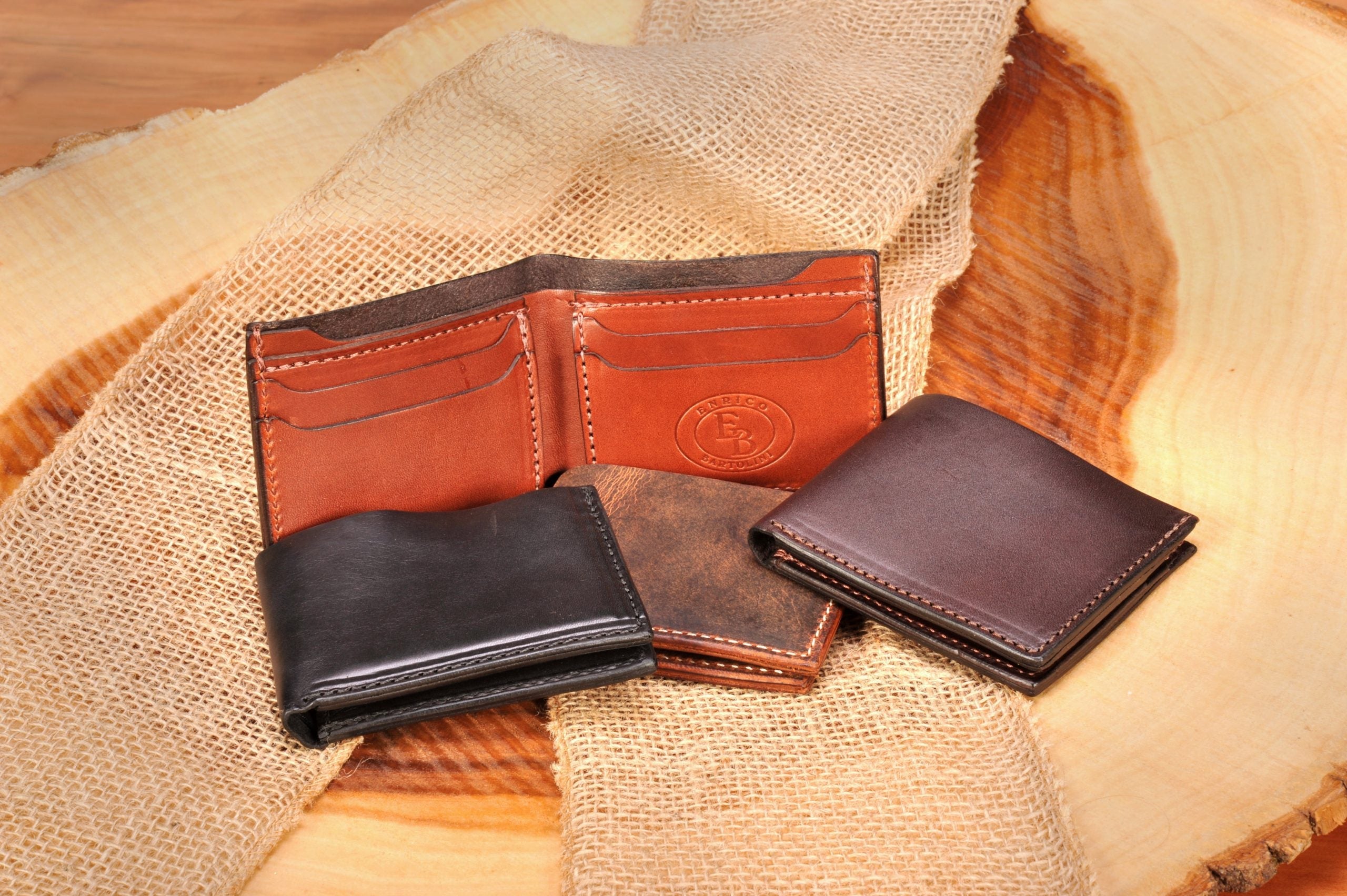 Leather Bi-fold Wallets and Credit Card Holders by Enrico Bartolini displayed in various colors