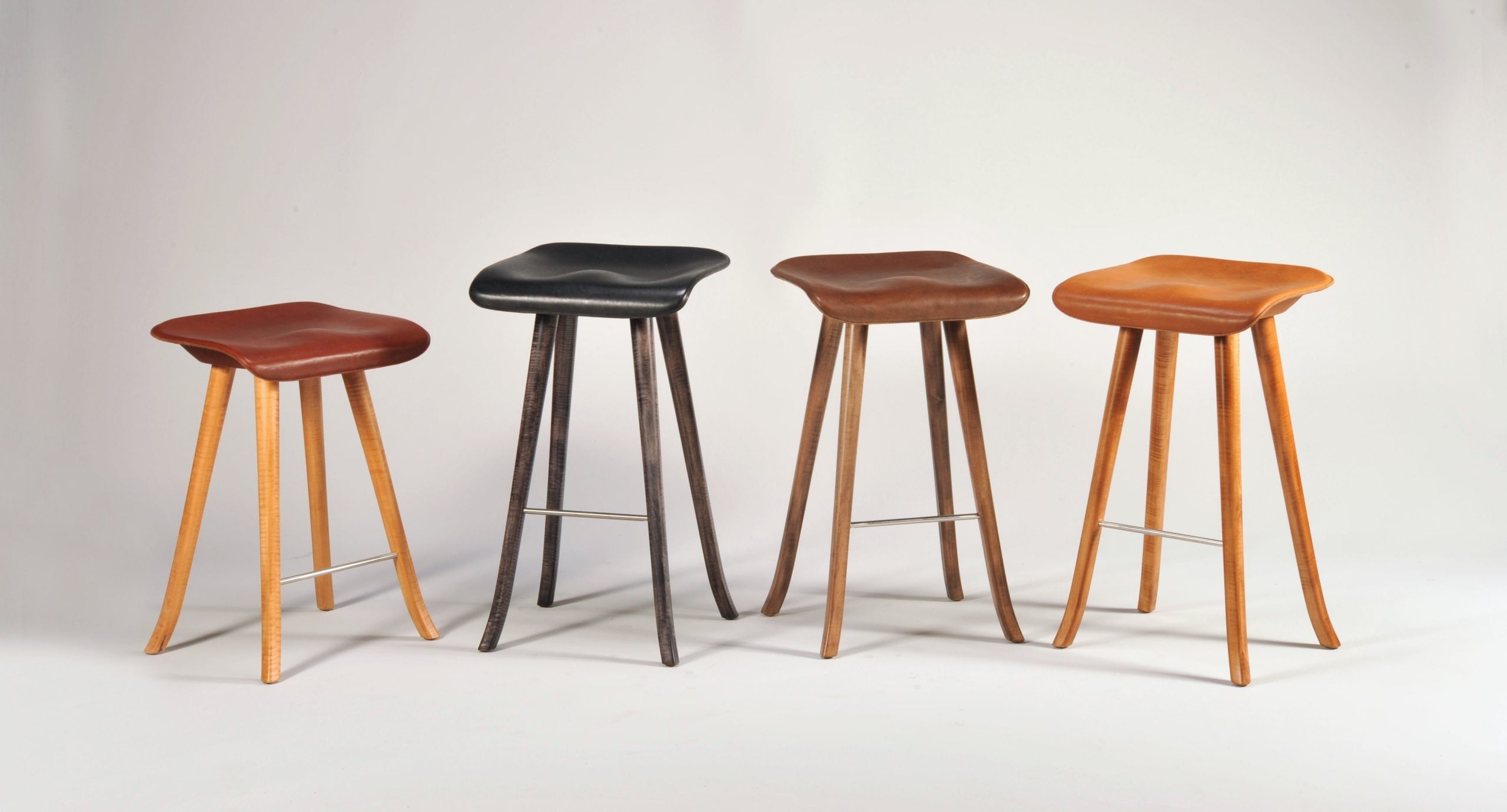 Tractor Seat Stools with machined Ash wood legs and leather seats by Enrico Bartolini