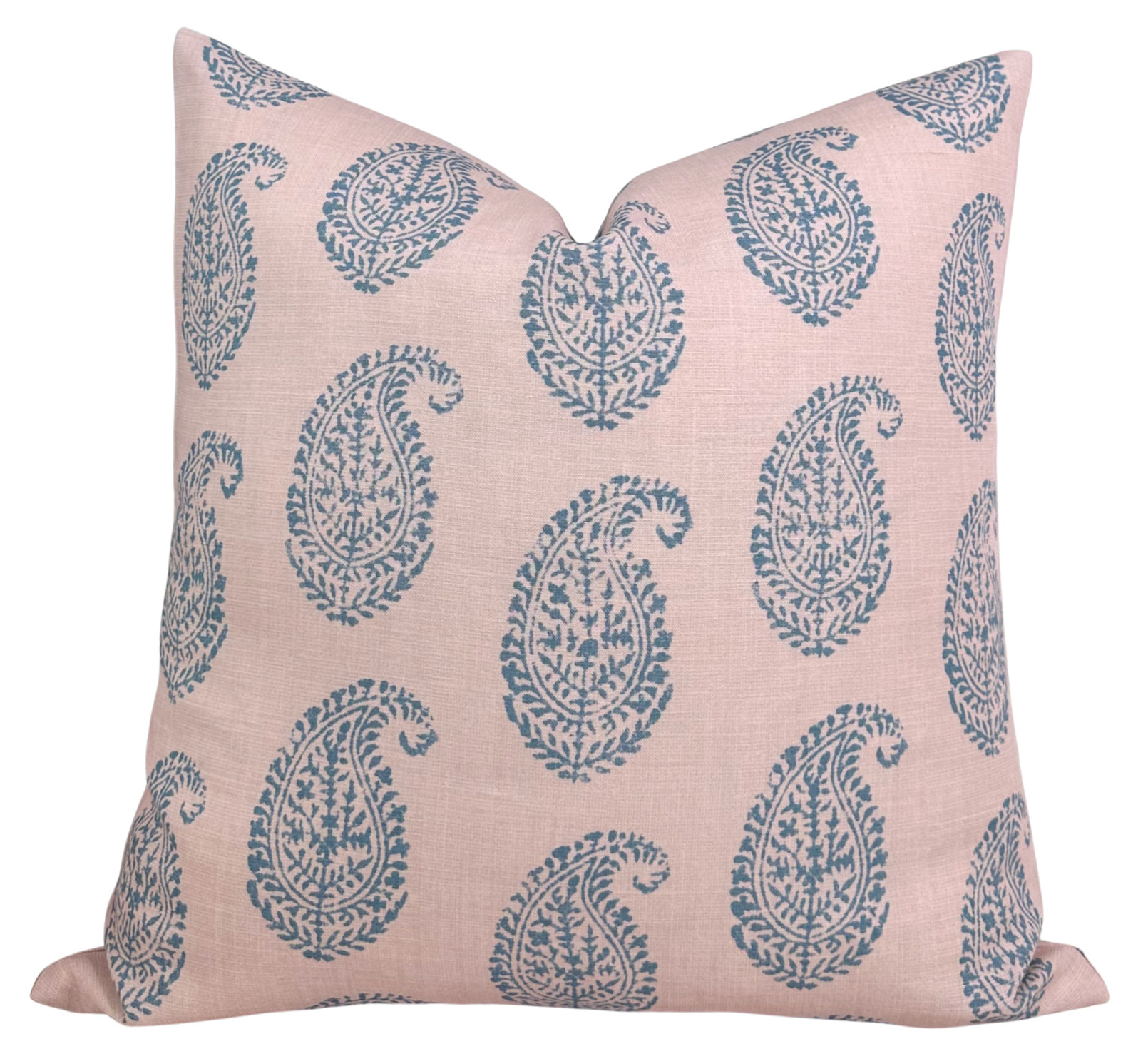 Kashmir Paisley Pillow Cover in Pink and Blue shown on a sofa with ivory linen backing