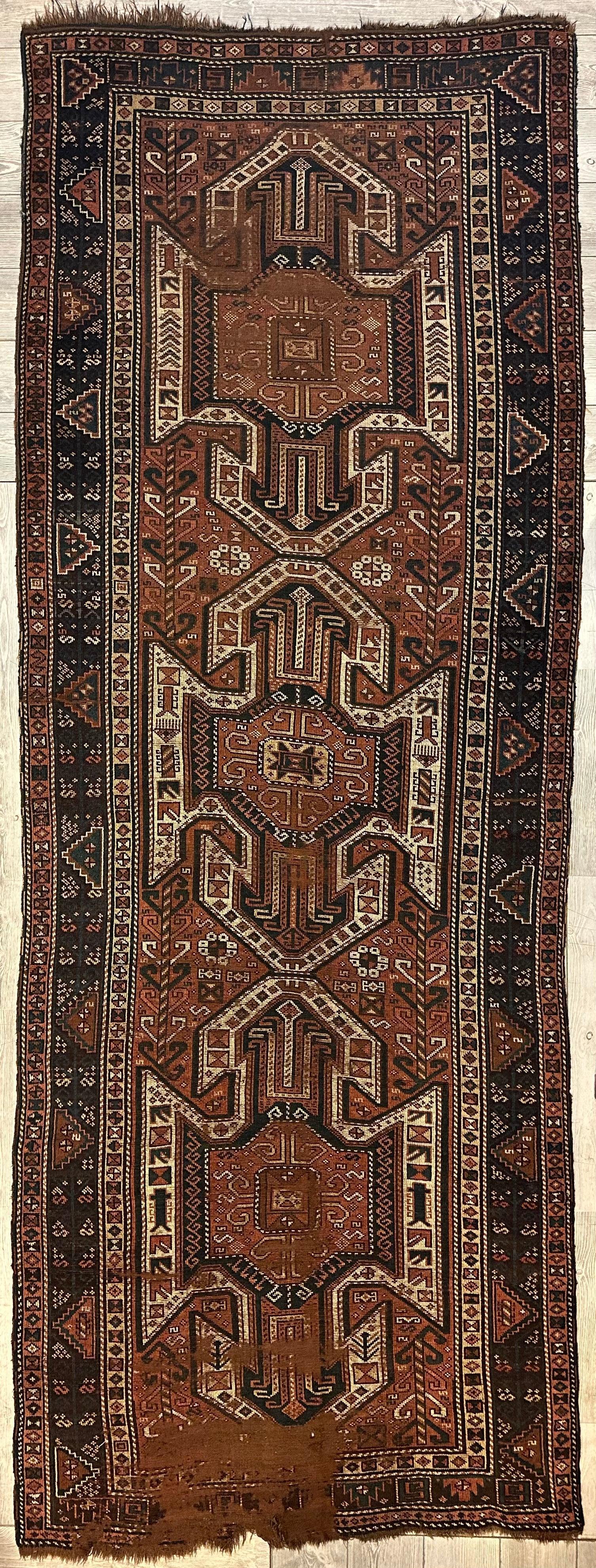 Photographs of the Pre-1900 Triple Shield Sewan Kazak rug showing detailed patterns in red, blue, and beige tones.